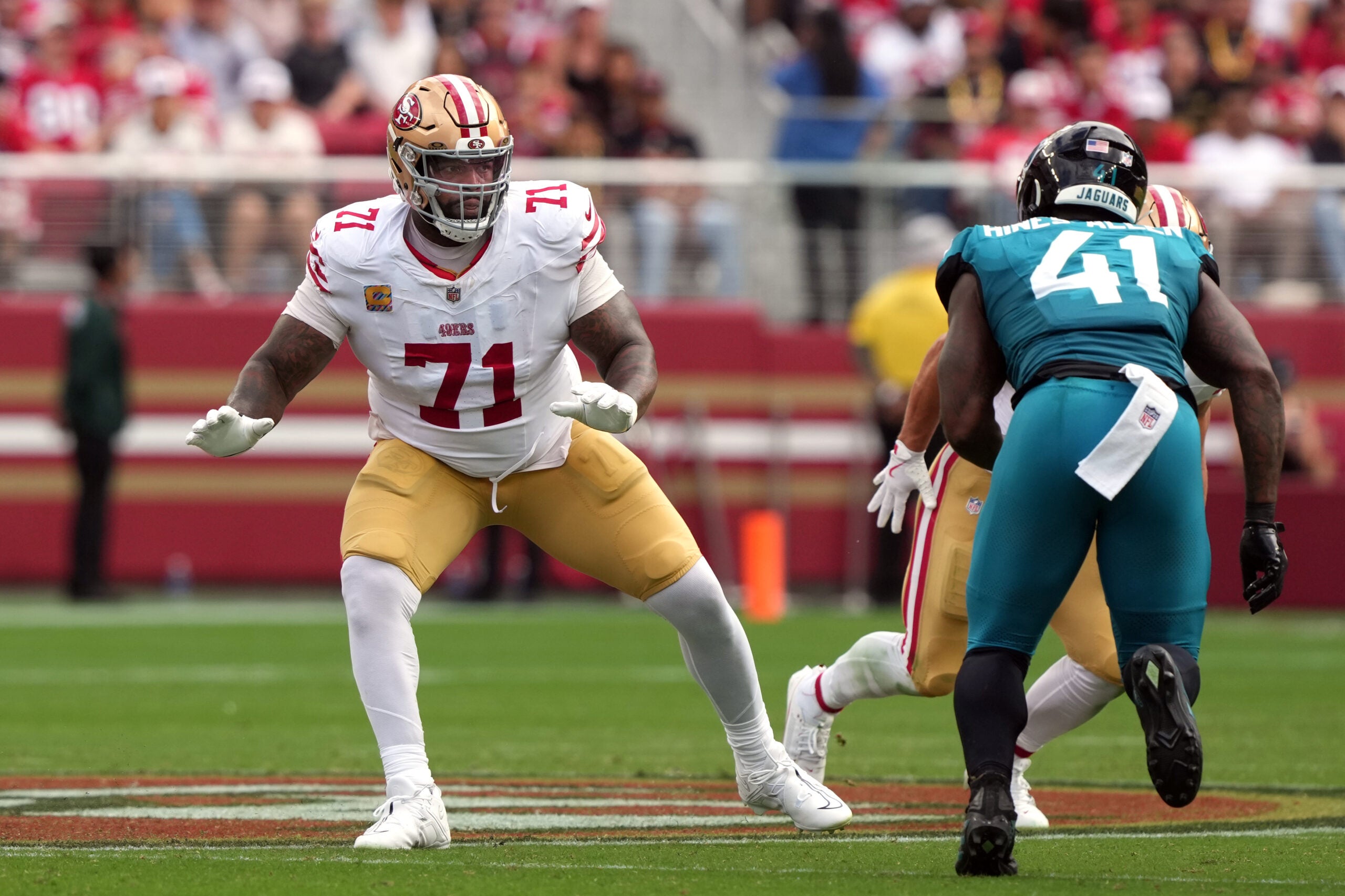 Sep 28, 2025; Santa Clara, California, USA; San Francisco 49ers offensive tackle Trent Williams (71) pass blocks against Jacksonville Jaguars defensive end Josh Hines-Allen (41) during the second quarter at Levi's Stadium.