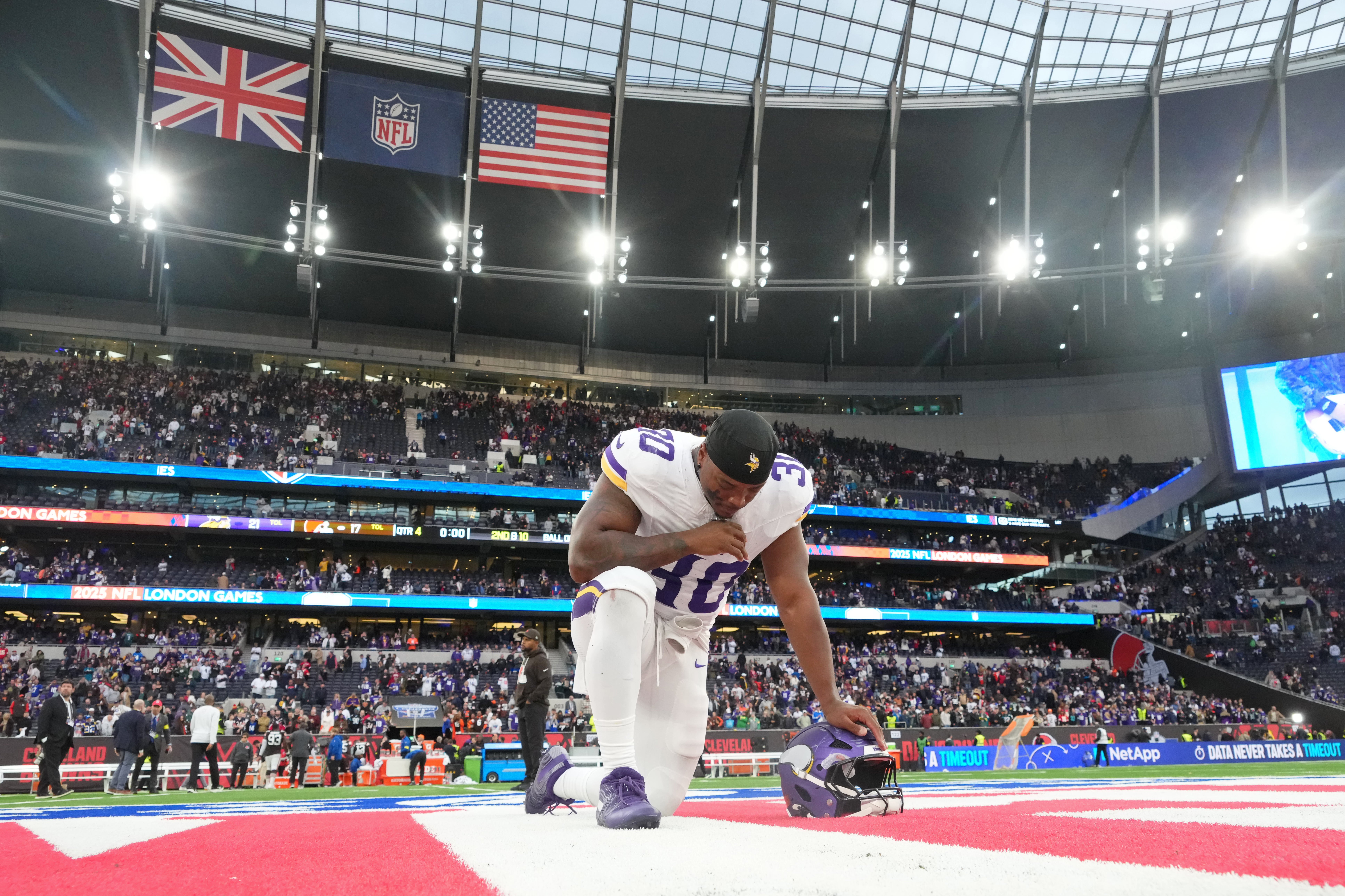 Minnesota Vikings fullback C.J. Ham (30) kneels at mid field after their win against the Cleveland Browns in an NFL International Series game at Tottenham Hotspur Stadium.