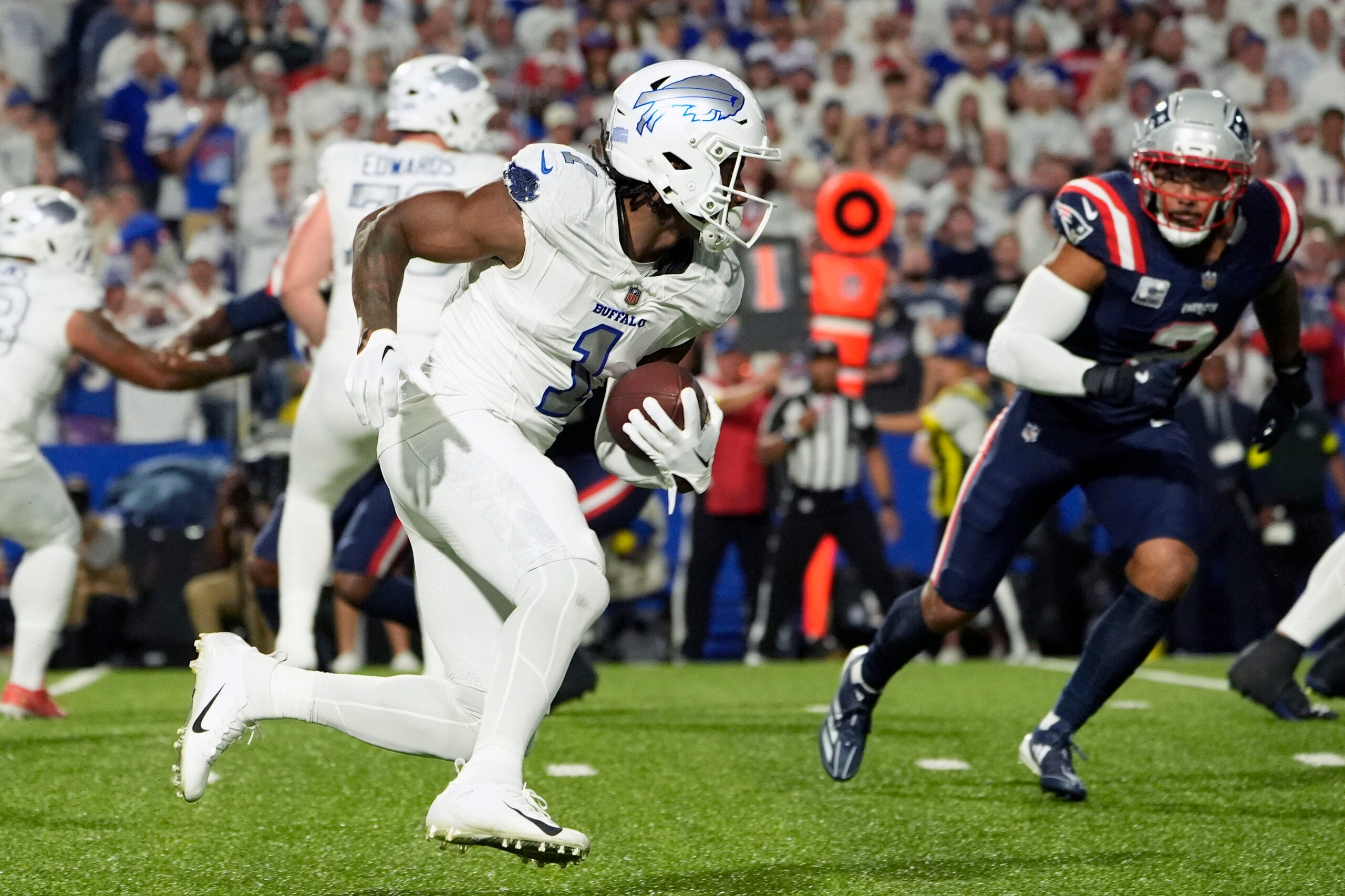 Oct 5, 2025; Orchard Park, New York, USA; Buffalo Bills wide receiver Curtis Samuel (1) makes a catch against the New England Patriots during the first half at Highmark Stadium.