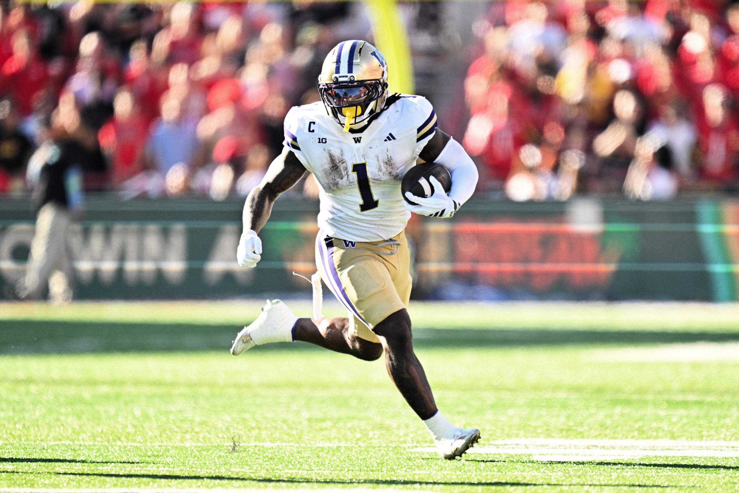 Oct 4, 2025; College Park, Maryland, USA; Washington Huskies running back Jonah Coleman (1) carries the ball against the Maryland Terrapins at SECU Stadium. Mandatory Credit: Jamie Sabau-Imagn Images