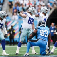 Oct 12, 2025; Charlotte, North Carolina, USA; Dallas Cowboys guard T.J. Bass (66) communicates during the second half against the Carolina Panthers at Bank of America Stadium.