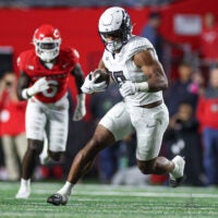 Oct 18, 2025; Piscataway, New Jersey, USA; Oregon Ducks tight end Kenyon Sadiq (18) gains yards after catch during the first half against the Rutgers Scarlet Knights at SHI Stadium. Mandatory Credit: Vincent Carchietta-Imagn Images
