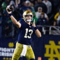 Oct 18, 2025; South Bend, Indiana, USA; Notre Dame Fighting Irish quarterback CJ Carr (13) drops back to pass the ball in the second half against the Southern California Trojans at Notre Dame Stadium. Mandatory Credit: Trevor Ruszkowski-Imagn Images