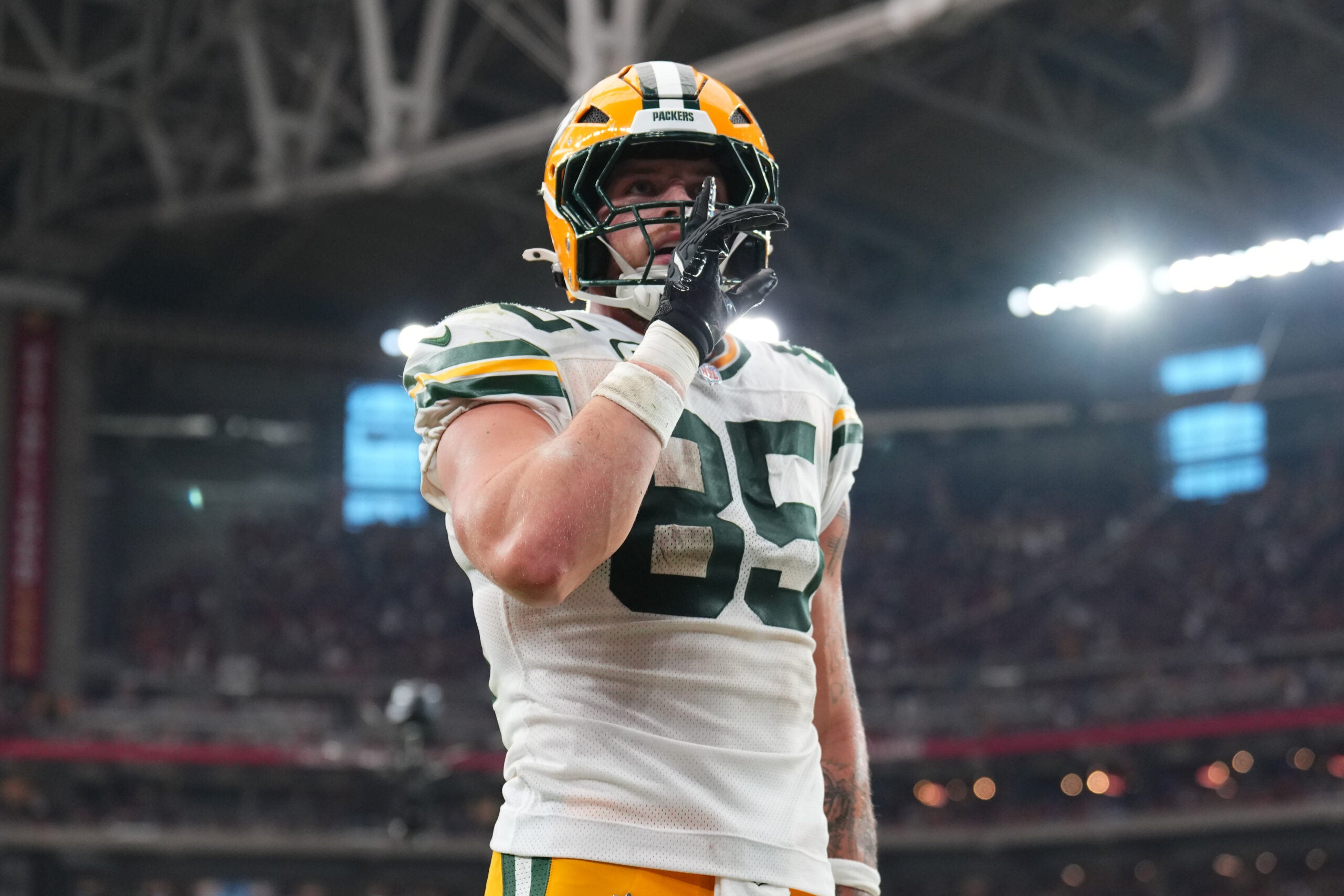 Oct 19, 2025; Glendale, Arizona, USA; Green Bay Packers tight end Tucker Kraft (85) celebrates a touchdown against the Arizona Cardinals during the second half at State Farm Stadium.