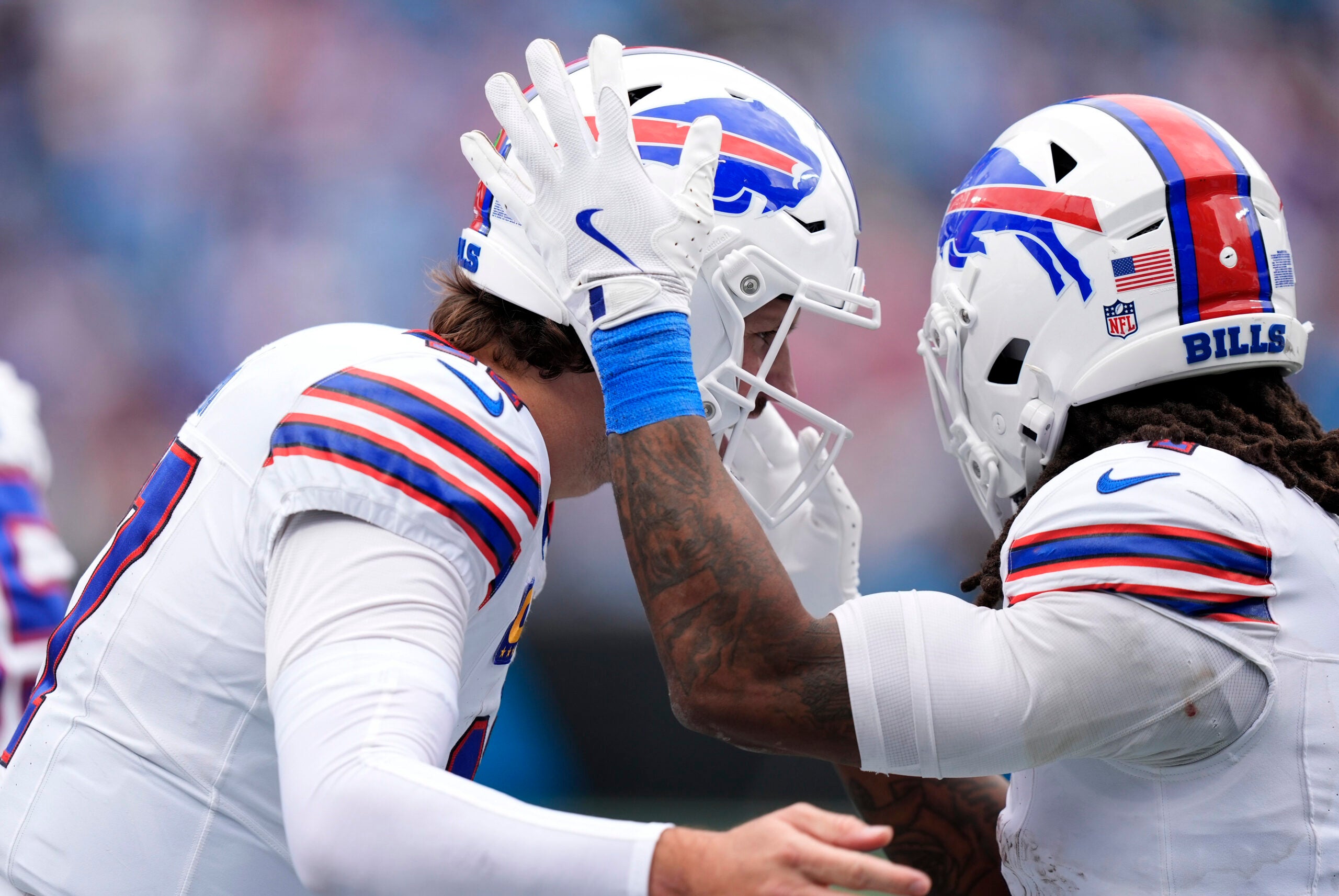 Oct 26, 2025; Charlotte, North Carolina, USA; Buffalo Bills running back James Cook III (4) celebrates with quarterback Josh Allen (17) after scoring a touchdown during the second half against the Carolina Panthers at Bank of America Stadium.