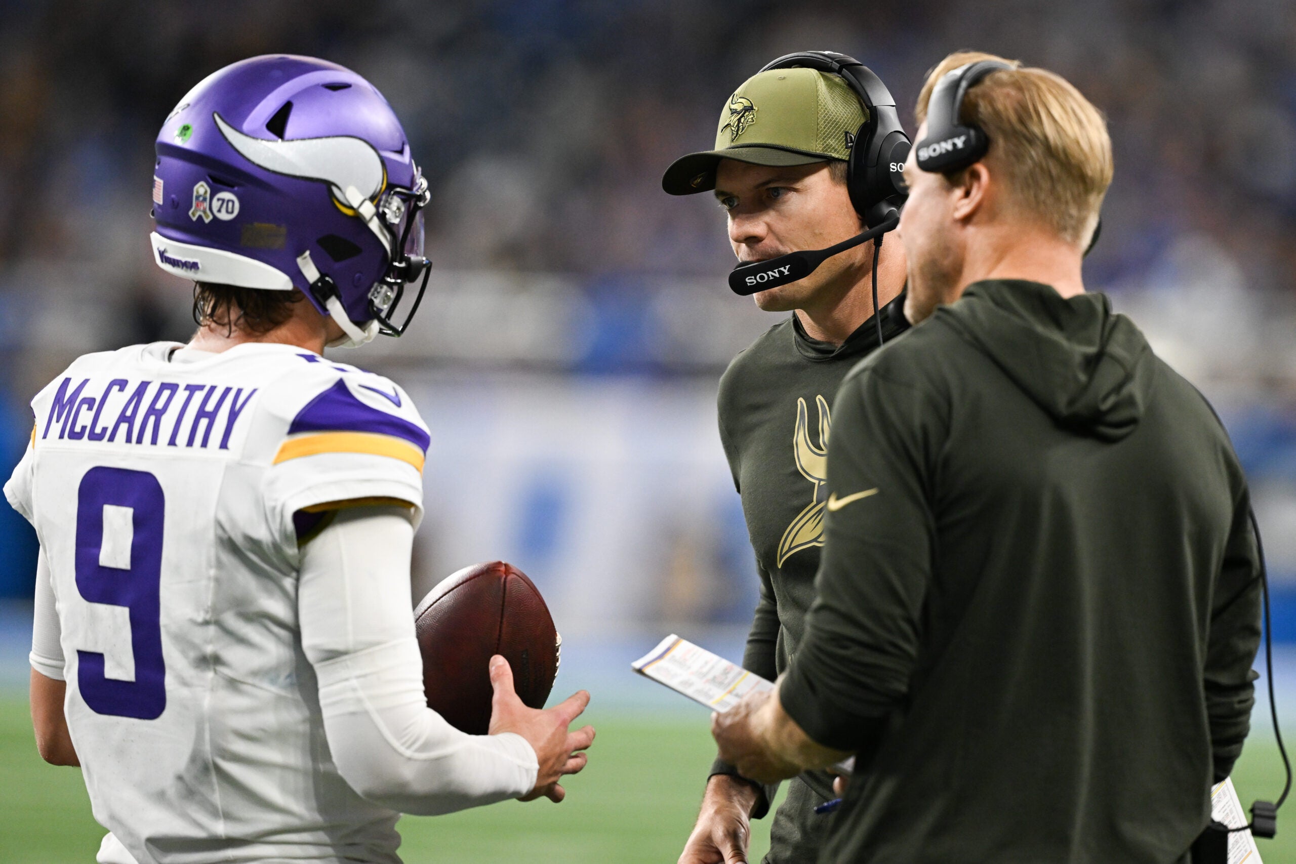 Nov 2, 2025; Detroit, Michigan, USA; Minnesota Vikings head coach Kevin O'Connell speaks with Minnesota Vikings quarterback J.J. McCarthy (9) in the first quarter against the Detroit Lions at Ford Field.