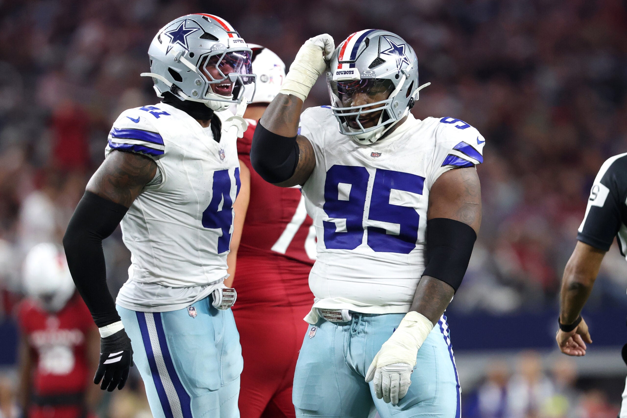 Nov 3, 2025; Arlington, Texas, USA; Dallas Cowboys defensive tackle Kenny Clark (95) and defensive end Donovan Ezeiruaku (41) celebrate after a sack Arizona Cardinals quarterback Jacoby Brissett (7) in the second half at AT&T Stadium.