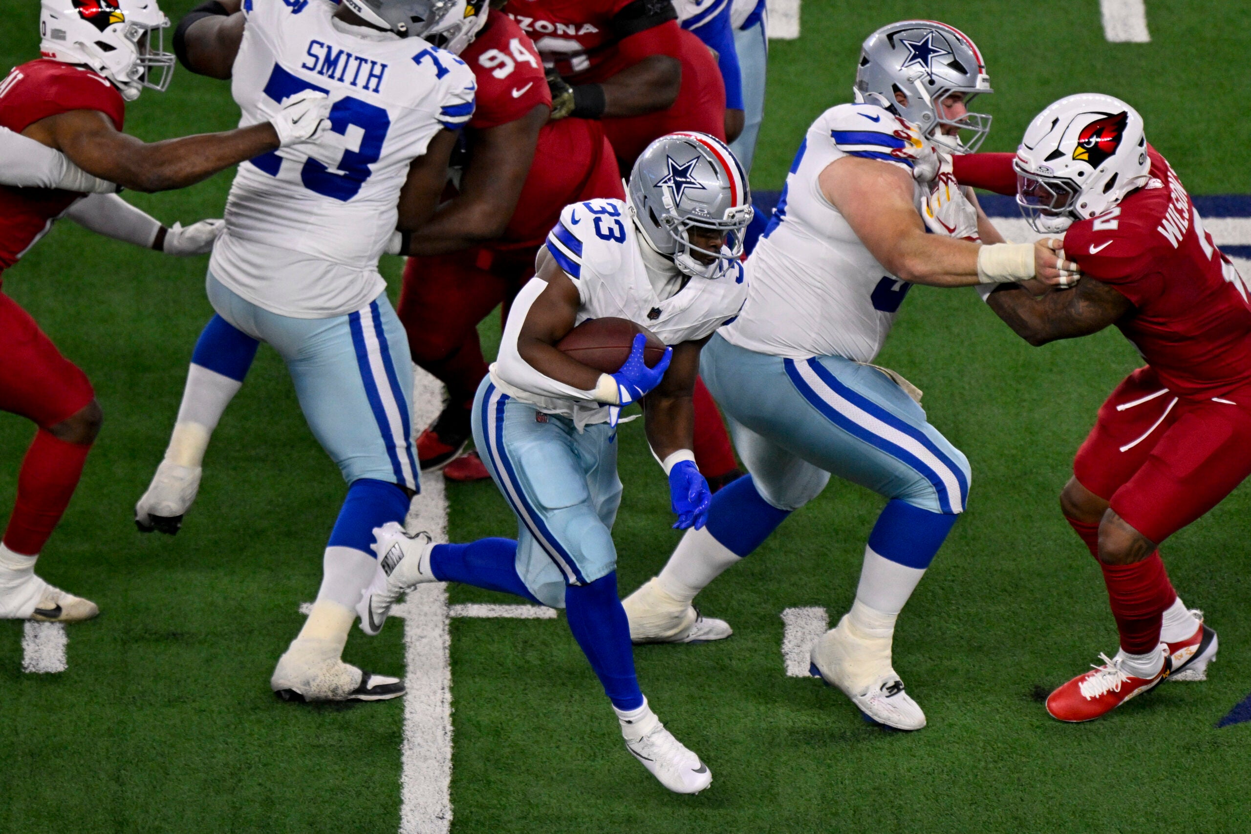 Nov 3, 2025; Arlington, Texas, USA; Dallas Cowboys running back Javonte Williams (33) runs with the ball during the game between the Dallas Cowboys and the Arizona Cardinals at AT&T Stadium.
