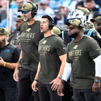 Nov 9, 2025; Charlotte, North Carolina, USA; Carolina Panthers head coach Dave Canales and coaching staff on the sidelines in the third quarter at Bank of America Stadium.