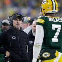 Green Bay Packers head coach Matt LaFleur approaches linebacker Quay Walker (7) after he was ejected from the game against the Detroit Lions during their football game Sunday, January 8, 2023, at Lambeau Field in Green Bay, Wis.