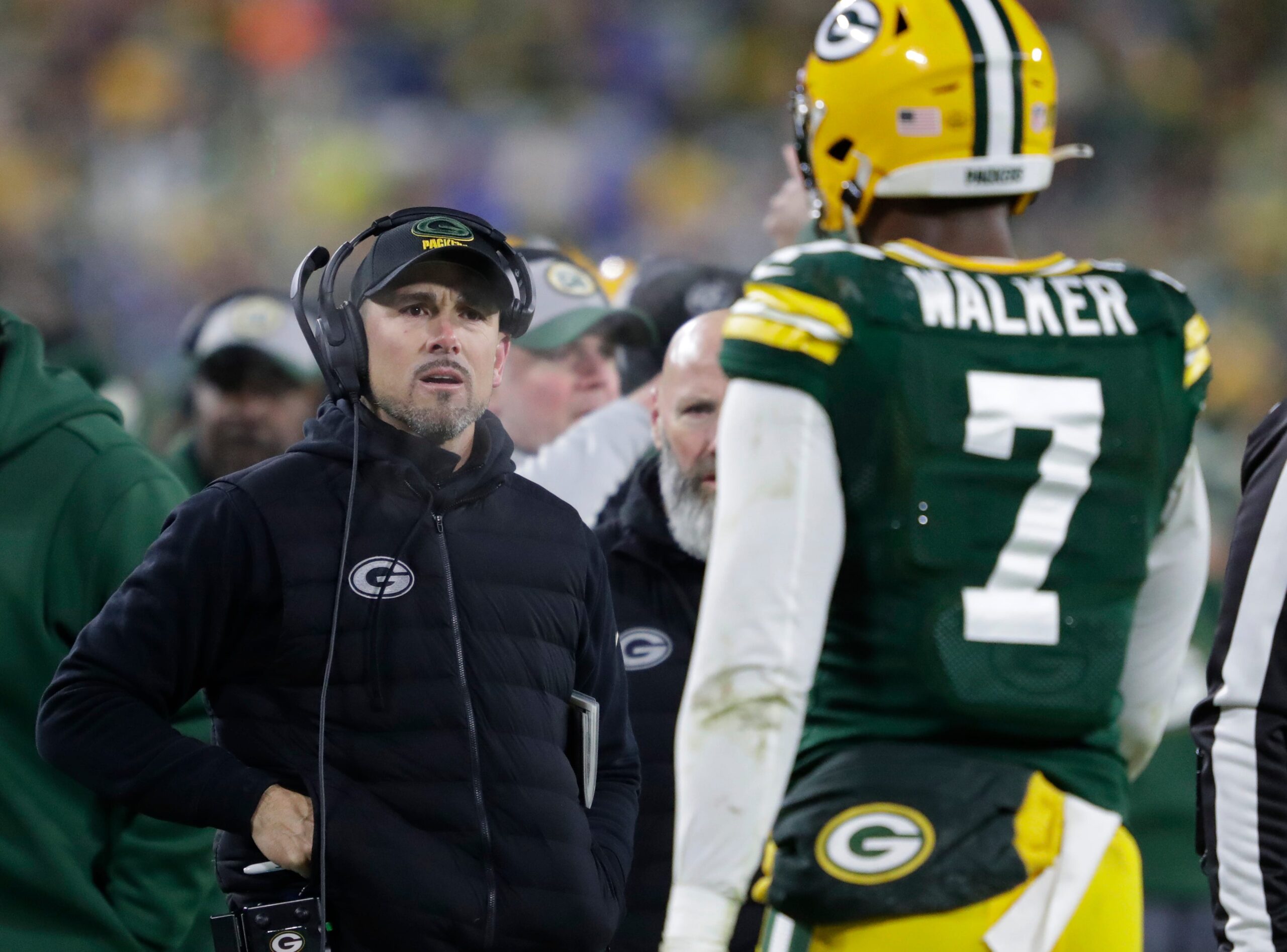 Green Bay Packers head coach Matt LaFleur approaches linebacker Quay Walker (7) after he was ejected from the game against the Detroit Lions during their football game Sunday, January 8, 2023, at Lambeau Field in Green Bay, Wis.