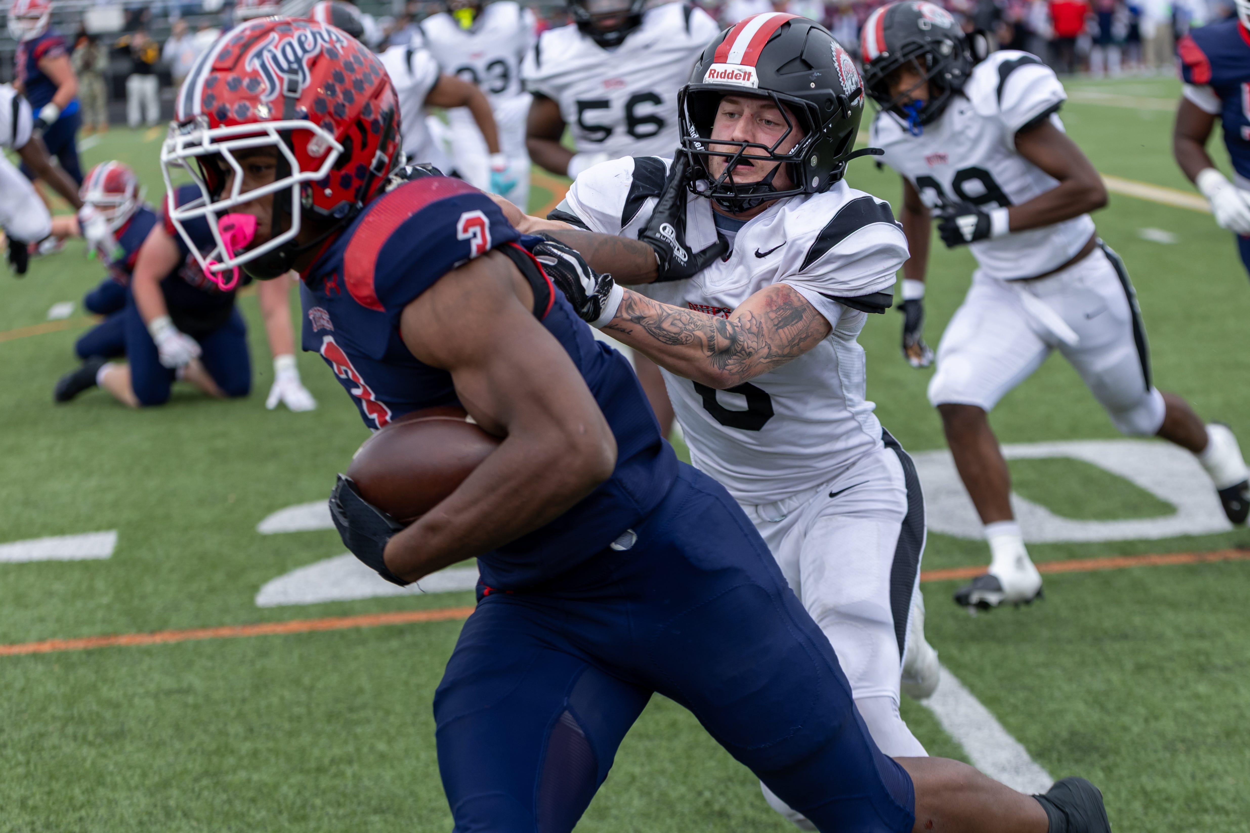 Aliquippa linebacker JJ Work (6) looks to drag down McKeesport running back Kemon Spell (3) in the first half of the WPIAL Class 4A championship game between Aliquippa and McKeesport Saturday, Nov. 15, 2025 at Pine-Richland Stadium in Gibsonia, Pa.