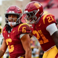 Nov 15, 2025; Los Angeles, California, USA; Southern California Trojans wide receiver Makai Lemon (6) celebrates his touchdown scored against the Iowa Hawkeyes with running back Bryan Jackson (21) during the second half at the Los Angeles Memorial Coliseum. Mandatory Credit: Gary A. Vasquez-Imagn Images