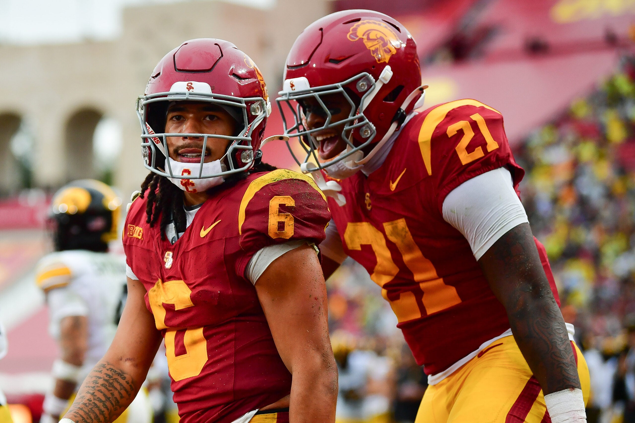 Nov 15, 2025; Los Angeles, California, USA; Southern California Trojans wide receiver Makai Lemon (6) celebrates his touchdown scored against the Iowa Hawkeyes with running back Bryan Jackson (21) during the second half at the Los Angeles Memorial Coliseum. Mandatory Credit: Gary A. Vasquez-Imagn Images