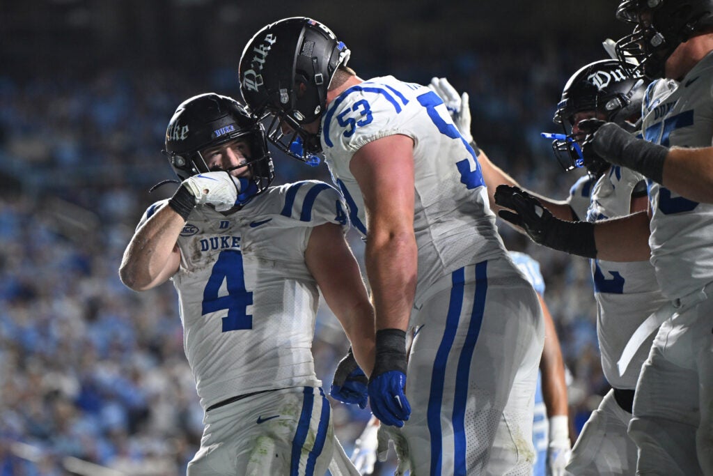 Nov 22, 2025; Chapel Hill, North Carolina, USA; Duke Blue Devils running back Anderson Castle (4) celebrates a touchdown with offensive lineman Brian Parker II (53) during the second half against North Carolina at Kenan Stadium.