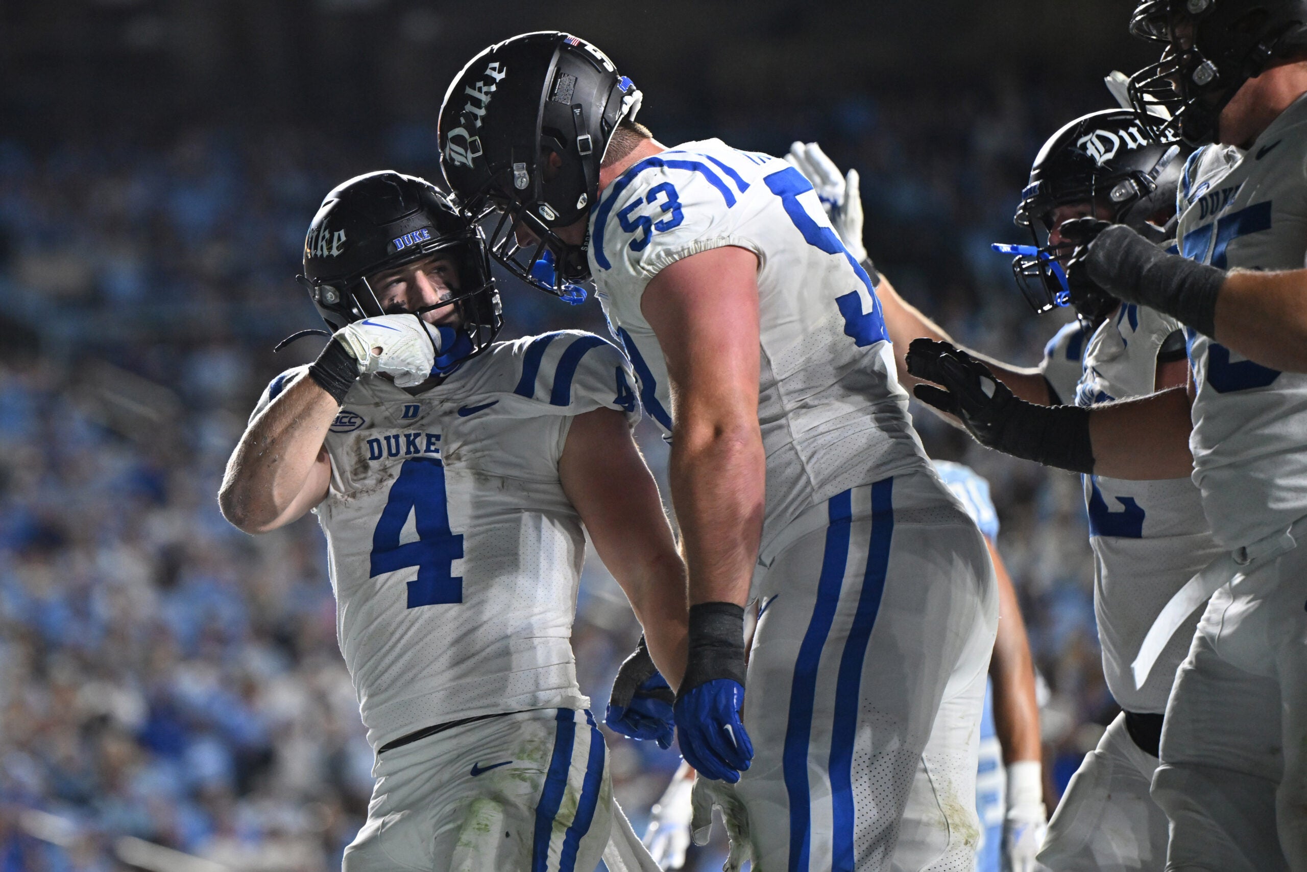 Nov 22, 2025; Chapel Hill, North Carolina, USA; Duke Blue Devils running back Anderson Castle (4) celebrates a touchdown with offensive lineman Brian Parker II (53) during the second half against North Carolina at Kenan Stadium.