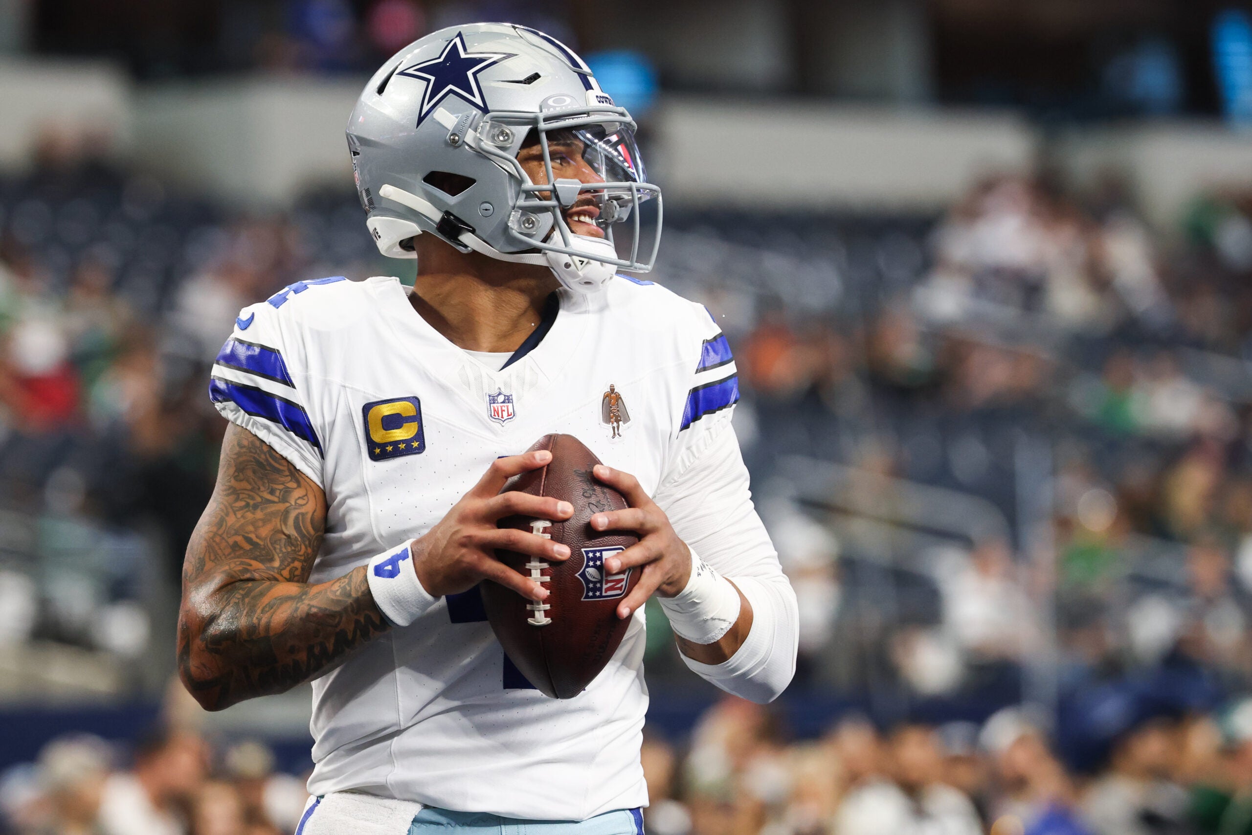 Nov 23, 2025; Arlington, Texas, USA; Dallas Cowboys quarterback Dak Prescott (4) warms up before the game against the Philadelphia Eagles at AT&T Stadium.