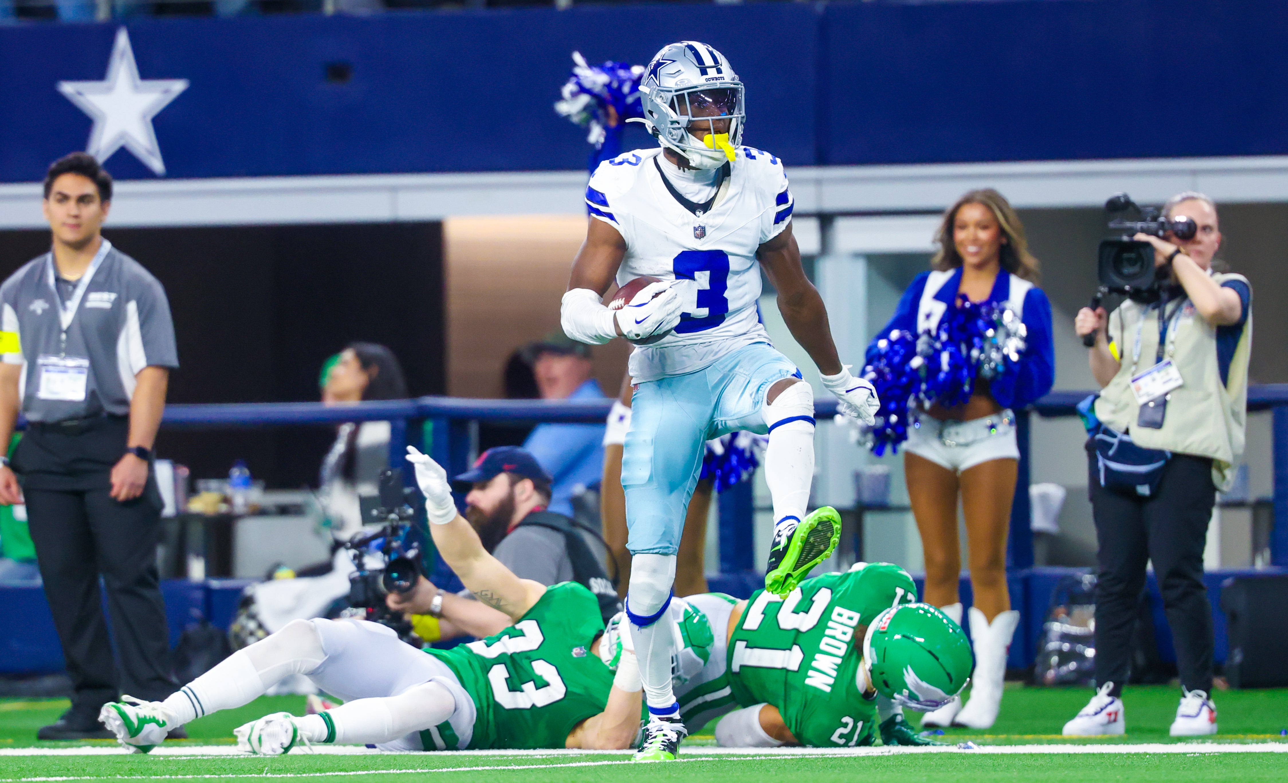 Nov 23, 2025; Arlington, Texas, USA; Dallas Cowboys wide receiver George Pickens (3) reacts after making a catch over Philadelphia Eagles cornerback Cooper DeJean (33) and Philadelphia Eagles safety Sydney Brown (21) during the game at AT&T Stadium.