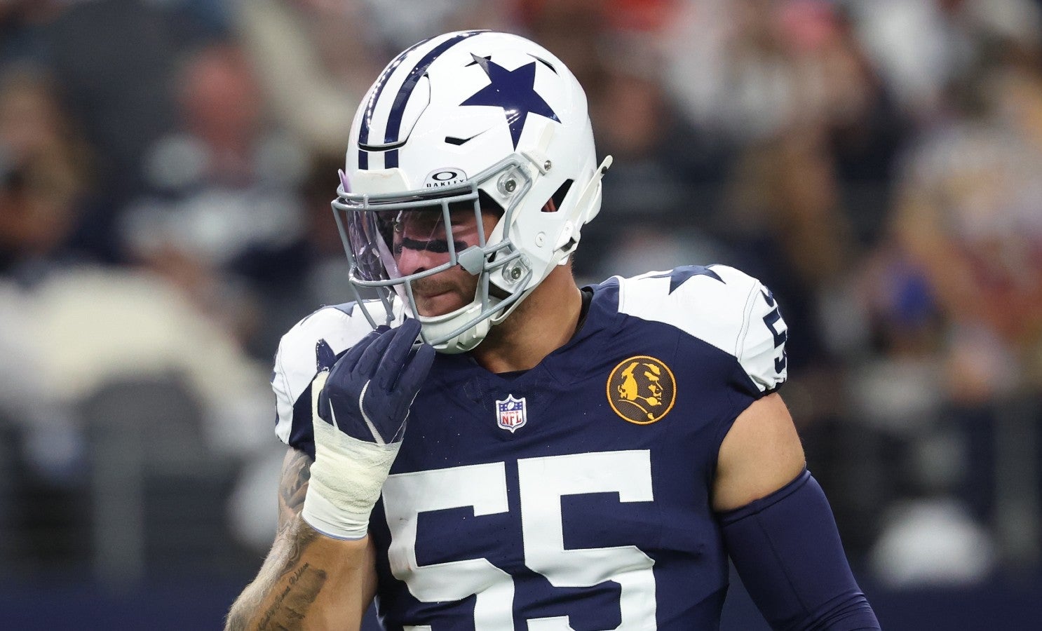 Nov 27, 2025; Arlington, Texas, USA; Dallas Cowboys linebacker Logan Wilson (55) warms up prior to the game against the Kansas City Chiefs at AT&T Stadium.
