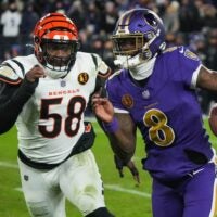 Bengals Joseph Ossai (58) rushes Ravens Lamar Jackson (8) during their game at M&T Bank Stadium on Thanksgiving Thursday November 27, 2025. The Bengals won the game with a final score of 33-14.