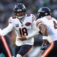 Nov 28, 2025; Philadelphia, Pennsylvania, USA; Chicago Bears quarterback Caleb Williams (18) hands off the ball to Chicago Bears running back D'Andre Swift (4) against the Philadelphia Eagles during the second quarter of the game at Lincoln Financial Field.
