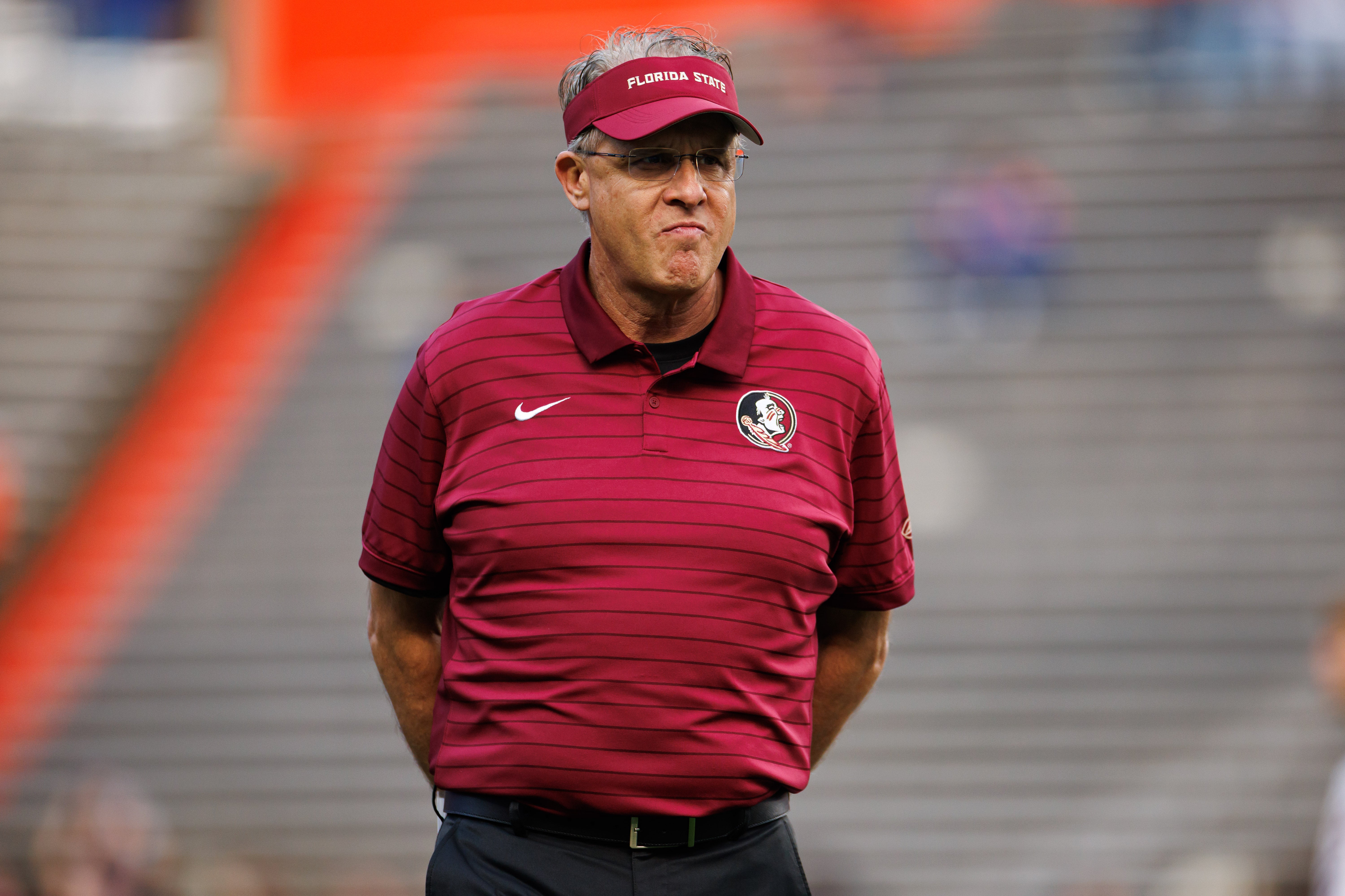 Nov 29, 2025; Gainesville, Florida, USA; Florida State Seminoles offensive coordinator Gus Malzahn looks on before a game against the Florida Gators at Ben Hill Griffin Stadium.