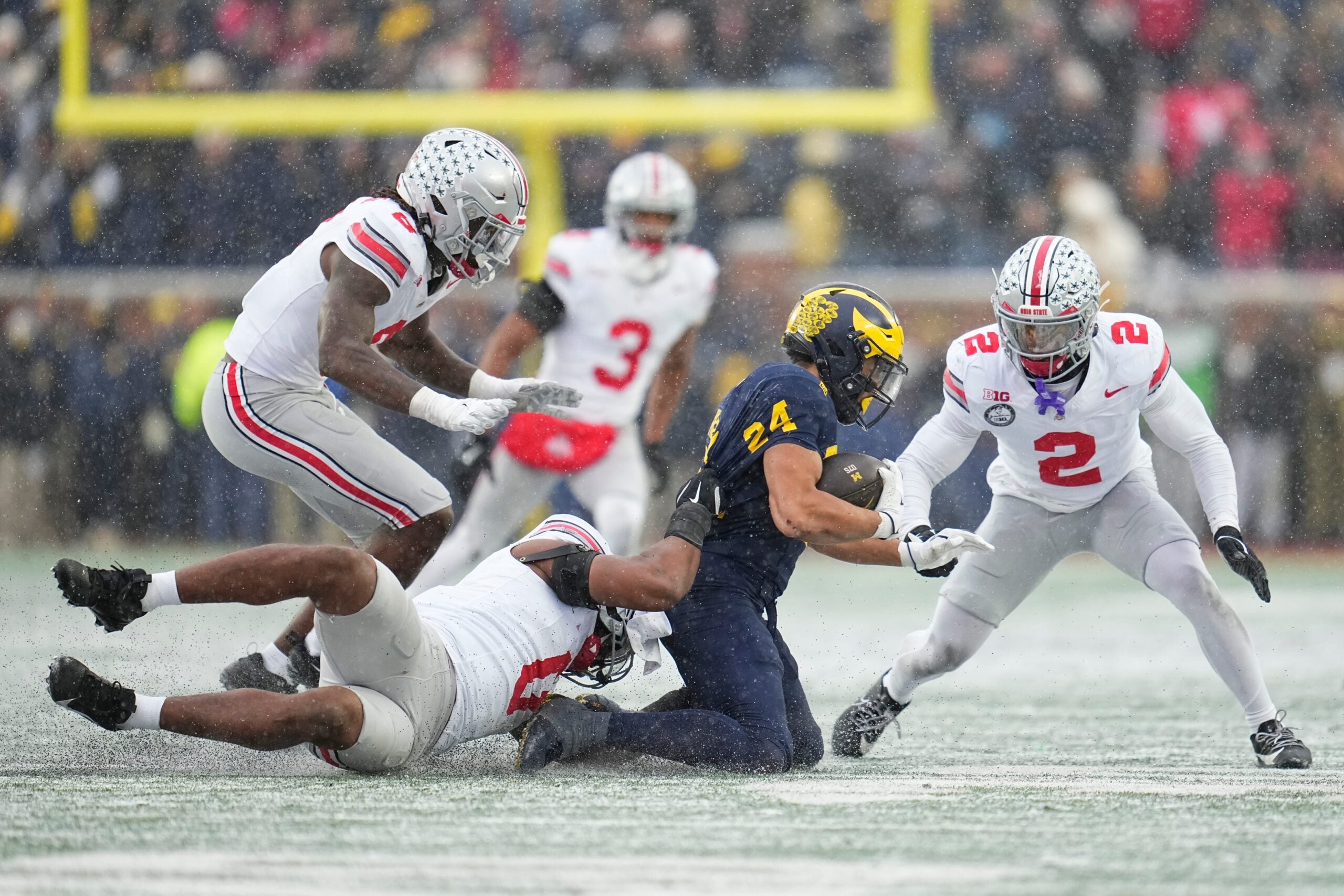 Ohio State Buckeyes linebacker Sonny Styles (0) tackles Michigan Wolverines running back Bryson Kuzdzal (24) during the NCAA football game at Michigan Stadium in Ann Arbor, Mich. on Nov. 29, 2025. Ohio State won 27-9.