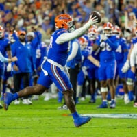 Nov 29, 2025; Gainesville, Florida, USA; Florida Gators defensive tackle Caleb Banks (88) celebrates recovering a fumble during the second quarter against the Florida State Seminoles at Ben Hill Griffin Stadium. Mandatory Credit: Bob Kupbens-Imagn Images