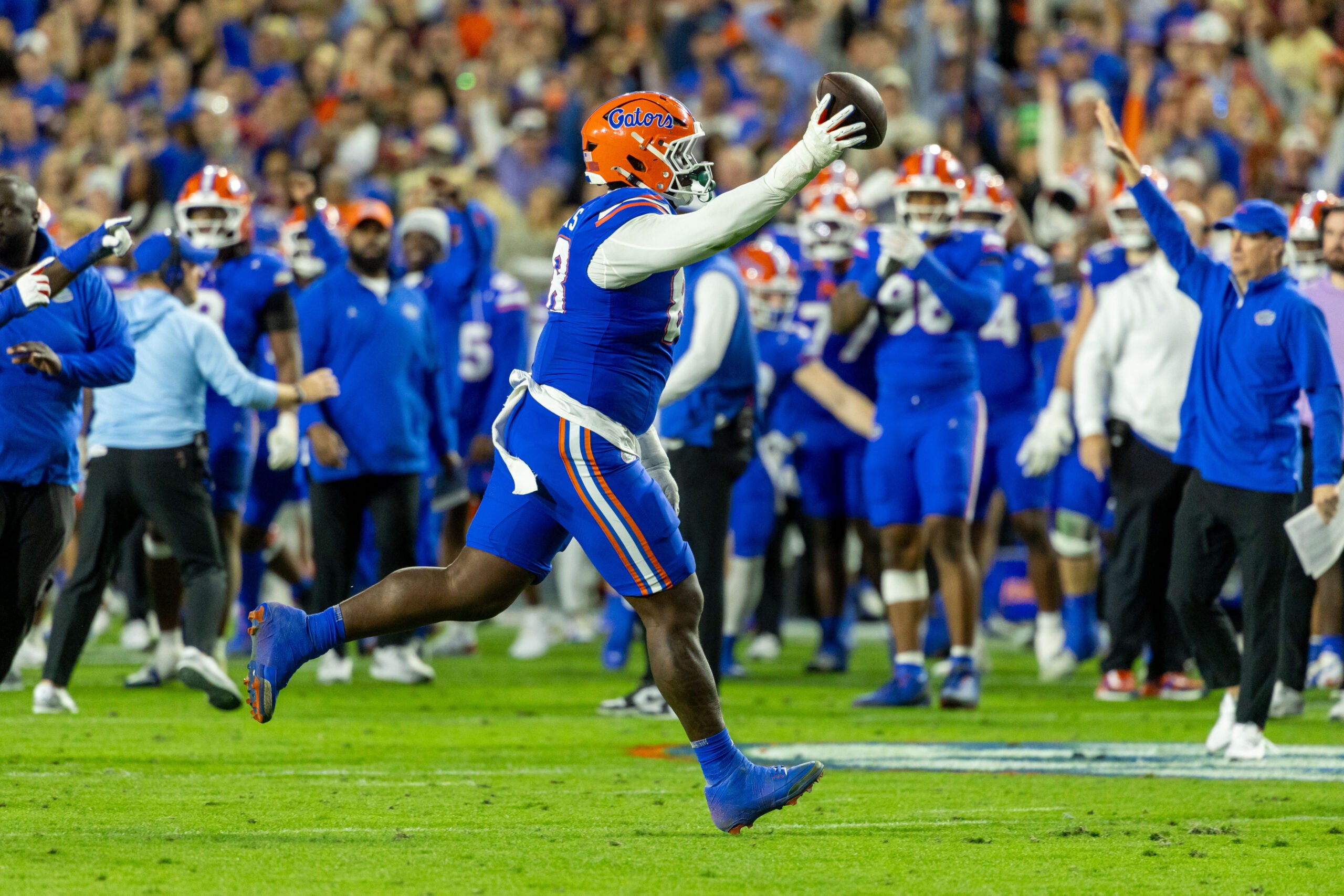 Nov 29, 2025; Gainesville, Florida, USA; Florida Gators defensive tackle Caleb Banks (88) celebrates recovering a fumble during the second quarter against the Florida State Seminoles at Ben Hill Griffin Stadium. Mandatory Credit: Bob Kupbens-Imagn Images