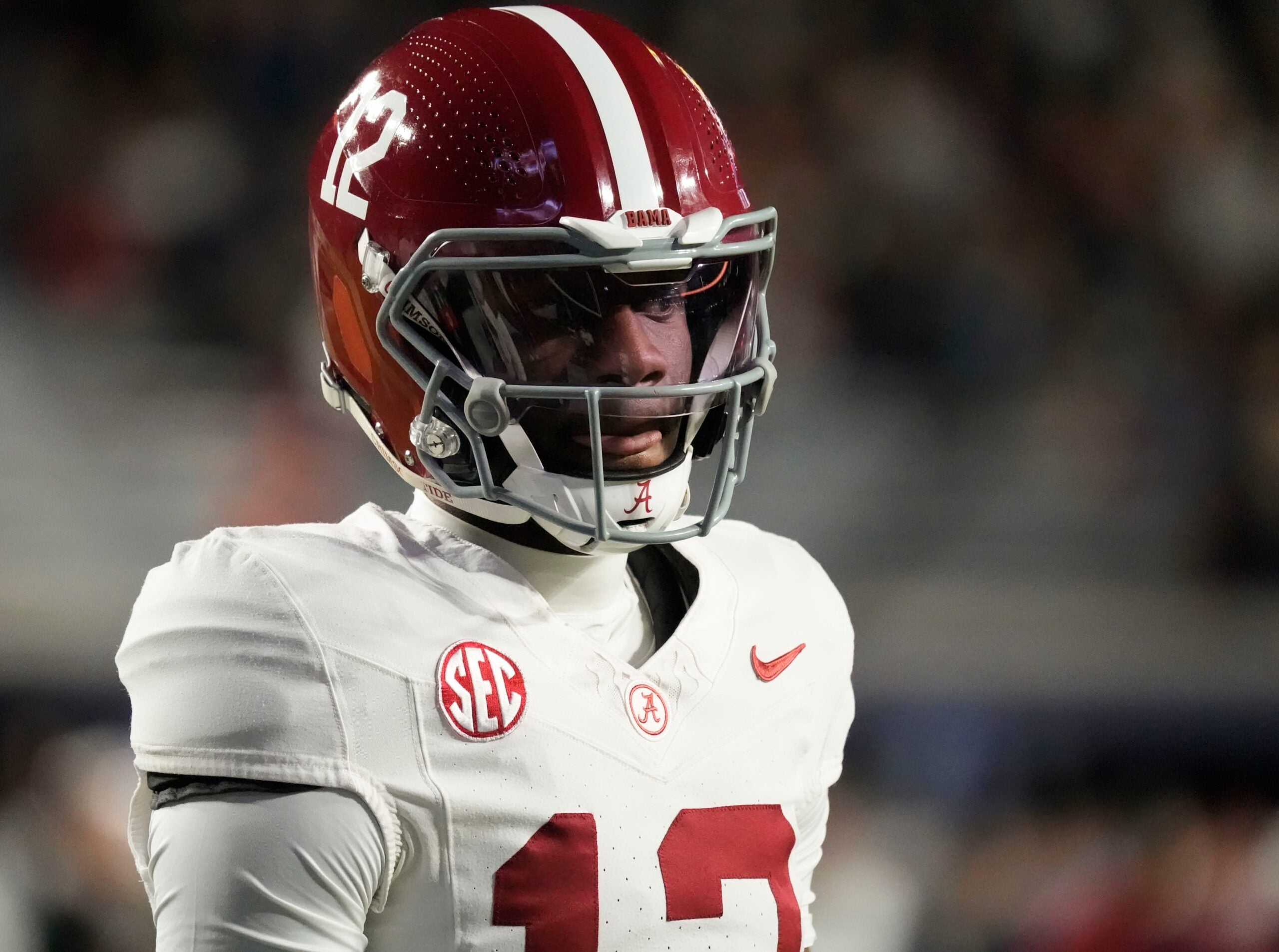 Nov 29, 2025; Auburn, Alabama, USA; Alabama quarterback Keelon Russell (12) warms up before the 2025 Iron Bowl game with Auburn Jordan-Hare Stadium.