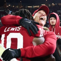 Nov 29, 2025; Norman, Oklahoma, USA; Oklahoma Sooners head coach Brent Venables hugs Oklahoma Sooners linebacker Kip Lewis (10) after the game against the Louisiana State Tigers at Gaylord Family-Oklahoma Memorial Stadium.
