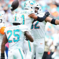 Nov 30, 2025; Miami Gardens, Florida, USA; Miami Dolphins defensive tackle Zach Sieler (92) reacts with safety Minkah Fitzpatrick (29) after forcing a fumble against the New Orleans Saints during the first half at Hard Rock Stadium.