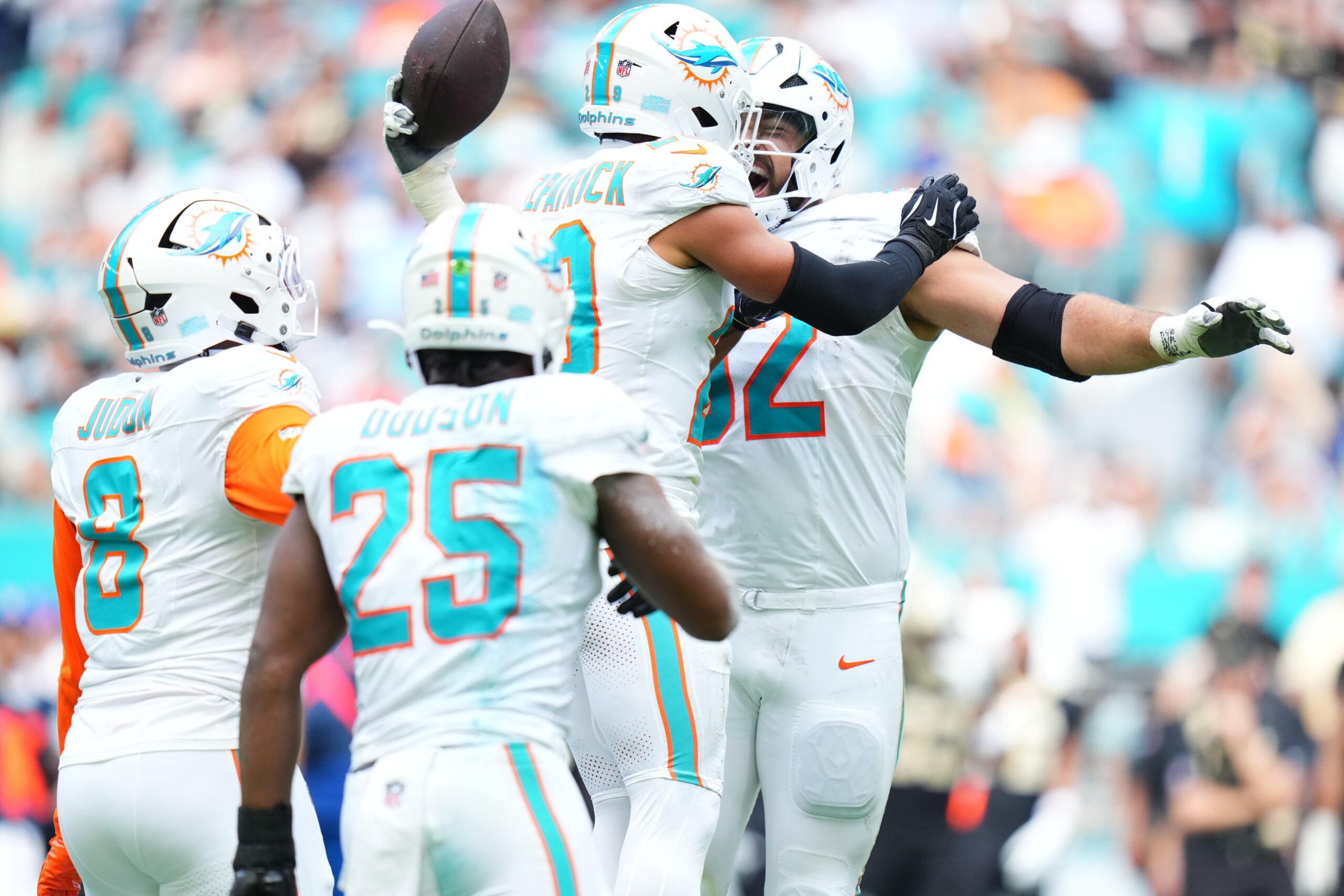 Nov 30, 2025; Miami Gardens, Florida, USA; Miami Dolphins defensive tackle Zach Sieler (92) reacts with safety Minkah Fitzpatrick (29) after forcing a fumble against the New Orleans Saints during the first half at Hard Rock Stadium.