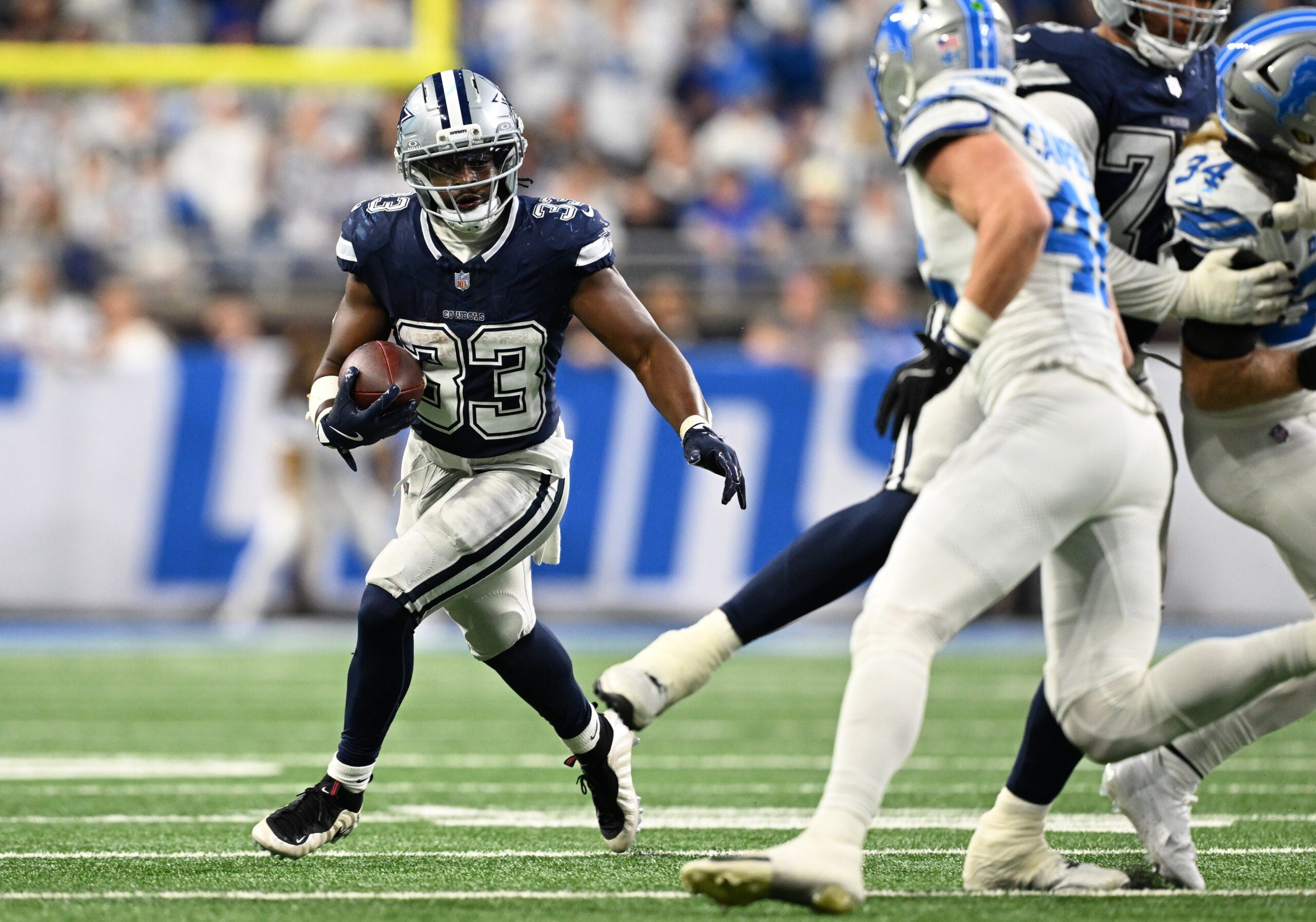 Dec 4, 2025; Detroit, Michigan, USA; Dallas Cowboys running back Javonte Williams (33) runs during the first half against the Detroit Lions at Ford Field.