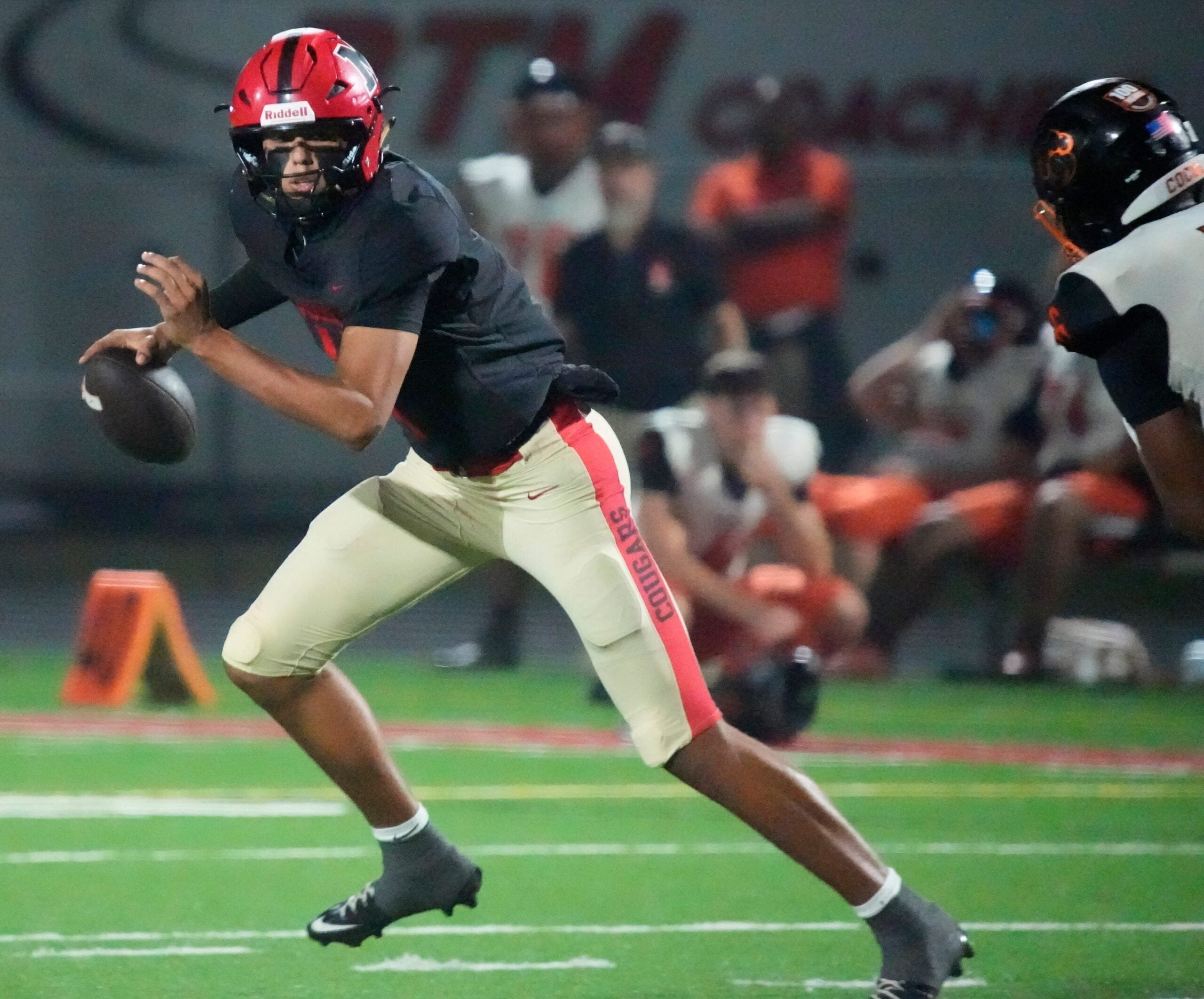 Mooney quarterback Davin Davidson (#4) scrambles as he looks for an open receiver. Cardinal Mooney Catholic High School hosted Cocoa High School for the Class 2A state semi-final football game Friday evening, Dec. 5, 2025. Mooney won the game 40-0.