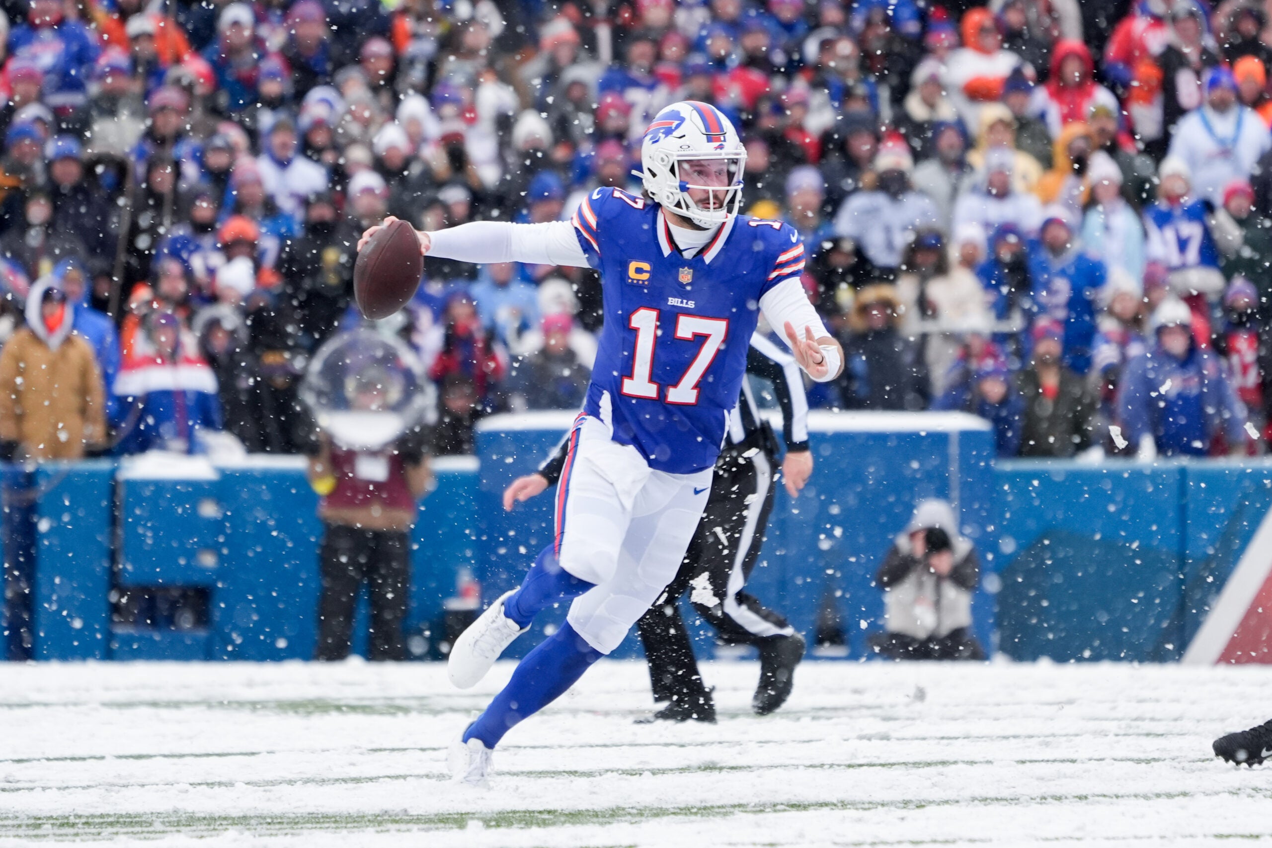 Dec 7, 2025; Orchard Park, New York, USA; Buffalo Bills quarterback Josh Allen (17) runs with the ball in the third quarter against the Cincinnati Bengals at Highmark Stadium.