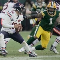Green Bay Packers defensive end Micah Parsons (1) pressures Chicago Bears quarterback Caleb Williams (18) during the first quarter of their game Sunday, December 7, 2025 at Lambeau Field in Green Bay, Wisconsin.