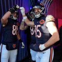 Dec 14, 2025; Chicago, Illinois, USA; Chicago Bears tight end Durham Smythe (81) and Chicago Bears tight end Cole Kmet (85) huddle before running onto the field for warmups prior to the game against the Cleveland Browns at Soldier Field.