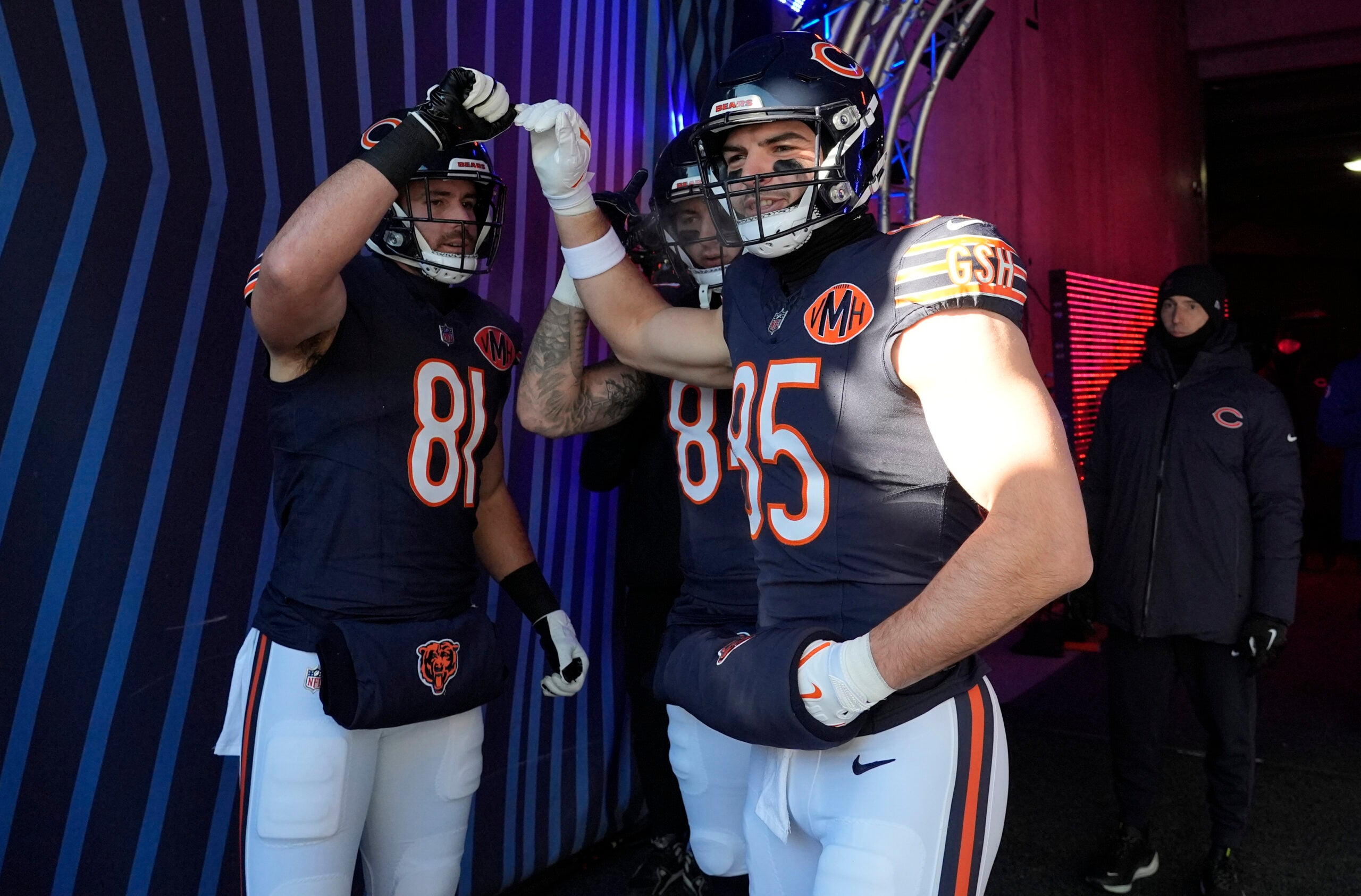 Dec 14, 2025; Chicago, Illinois, USA; Chicago Bears tight end Durham Smythe (81) and Chicago Bears tight end Cole Kmet (85) huddle before running onto the field for warmups prior to the game against the Cleveland Browns at Soldier Field.