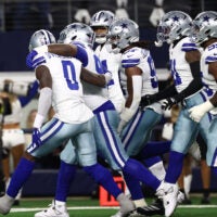 Dec 14, 2025; Arlington, Texas, USA; Dallas Cowboys defense celebrates after a turnover during the first half against the Minnesota Vikings at AT&T Stadium.