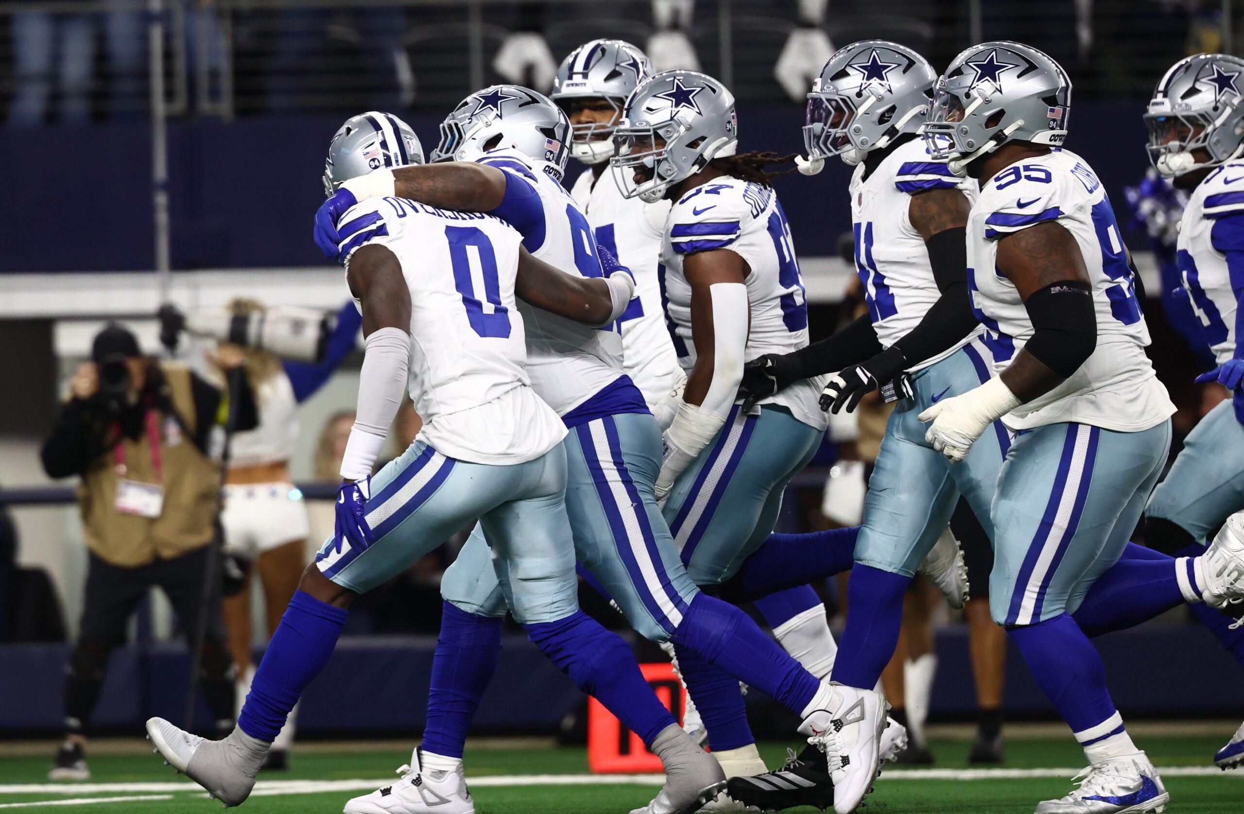 Dec 14, 2025; Arlington, Texas, USA; Dallas Cowboys defense celebrates after a turnover during the first half against the Minnesota Vikings at AT&T Stadium.
