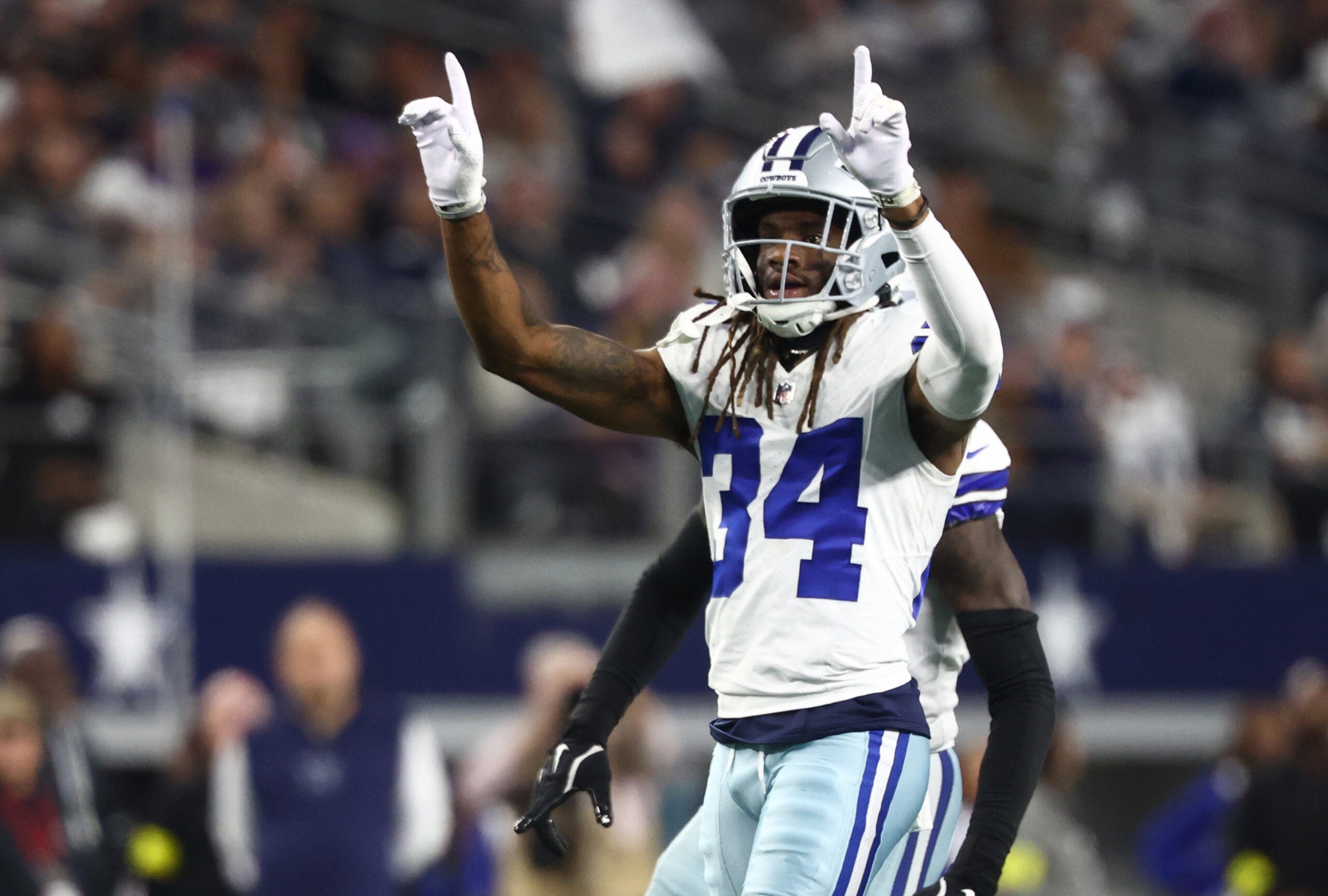 Dec 14, 2025; Arlington, Texas, USA; Dallas Cowboys cornerback Shavon Revel Jr. (34) celebrates after a play during the first half against the Minnesota Vikings at AT&T Stadium.