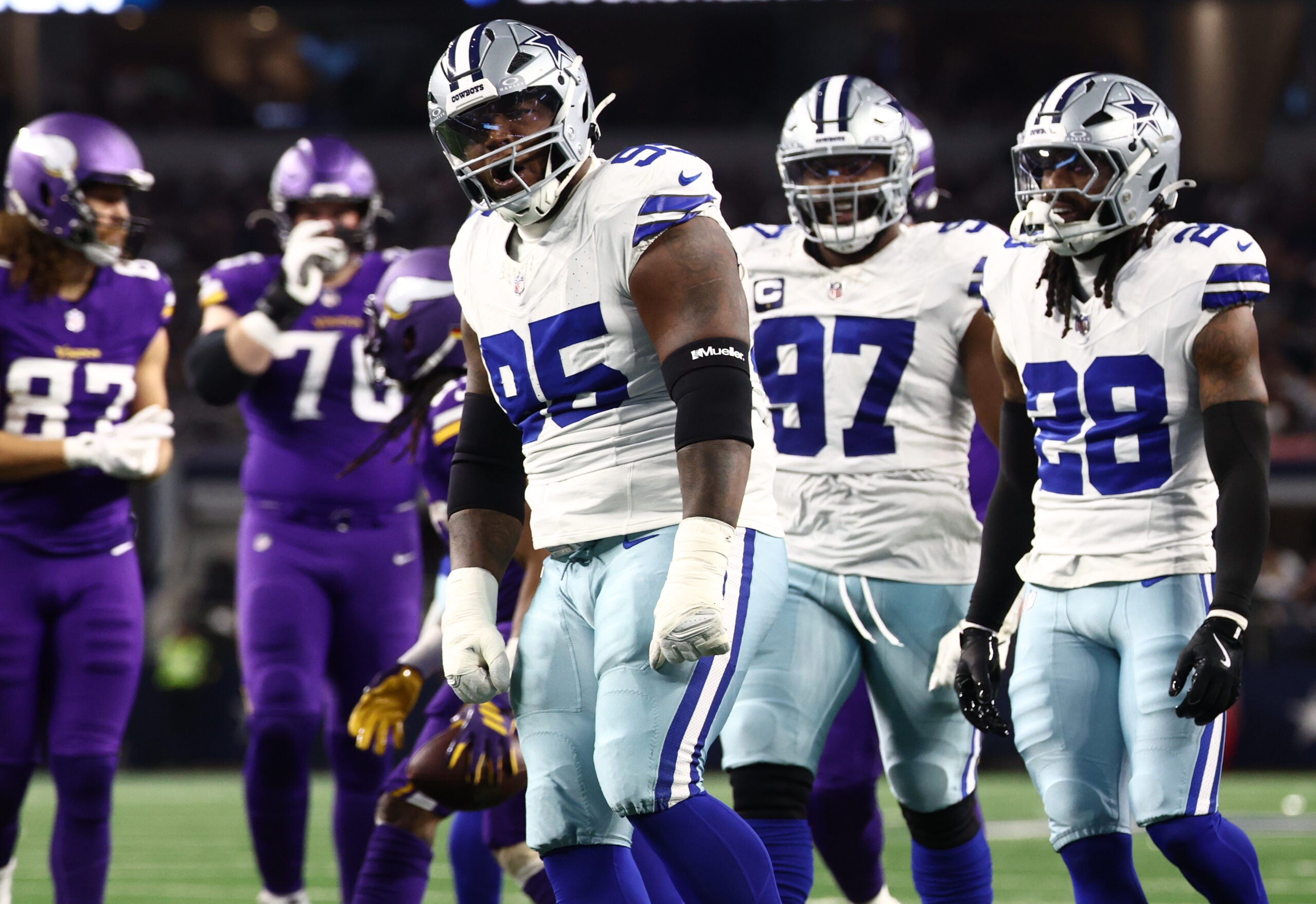 Dec 14, 2025; Arlington, Texas, USA; Dallas Cowboys defensive tackle Kenny Clark (95) celebrates after a play during the first half against the Minnesota Vikings at AT&T Stadium.