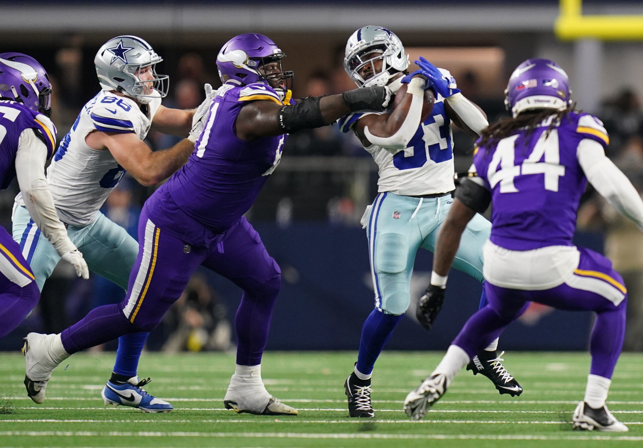 Dec 14, 2025; Arlington, Texas, USA; Dallas Cowboys running back Javonte Williams (33) runs against Minnesota Vikings defensive tackle Jalen Redmond (61) during the second half at AT&T Stadium.