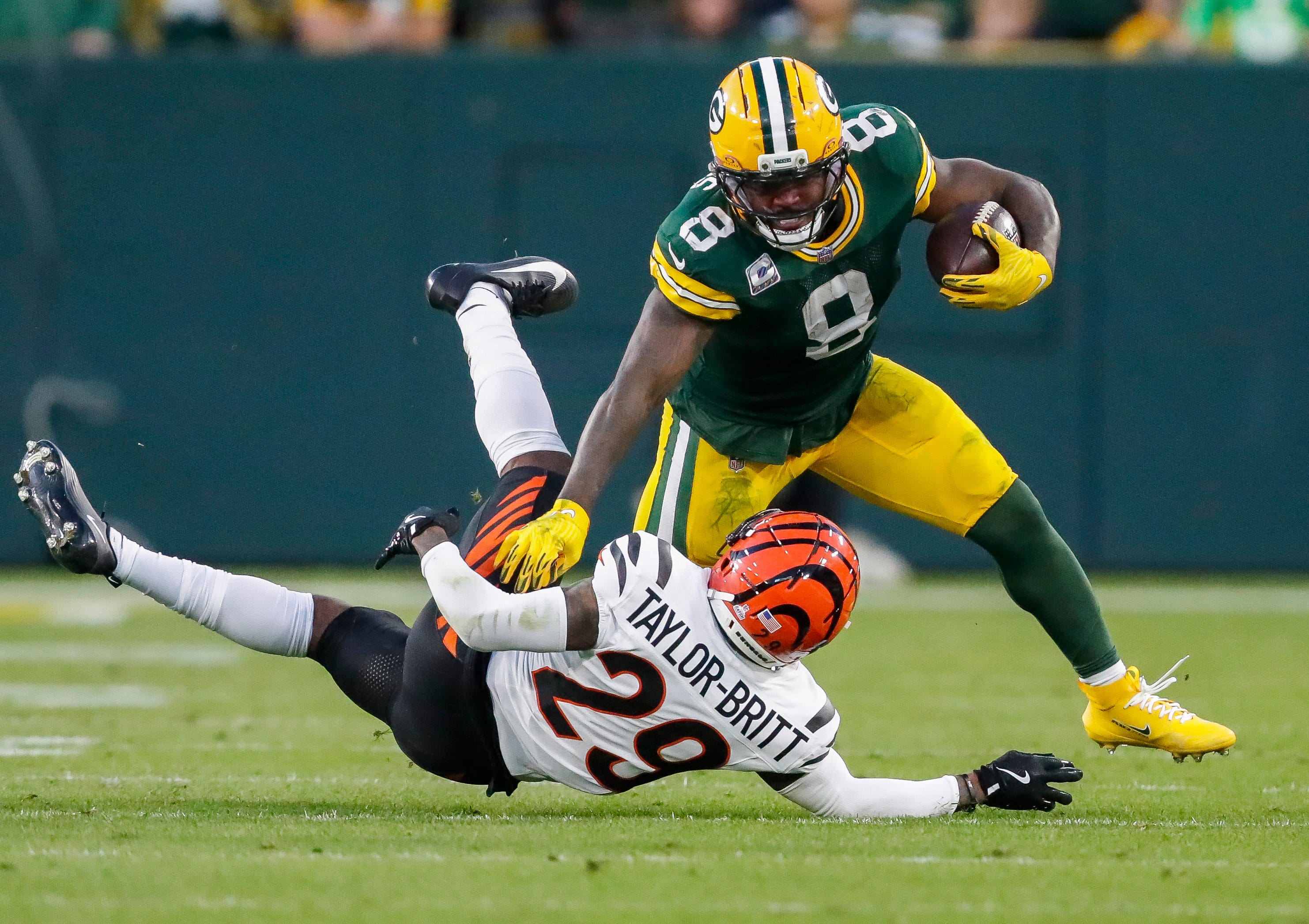 Green Bay Packers running back Josh Jacobs (8) stiff-arms Cincinnati Bengals cornerback Cam Taylor-Britt (29) on Sunday, October 12, 2025, at Lambeau Field in Green Bay, Wis. The Packers won the game, 27-18.