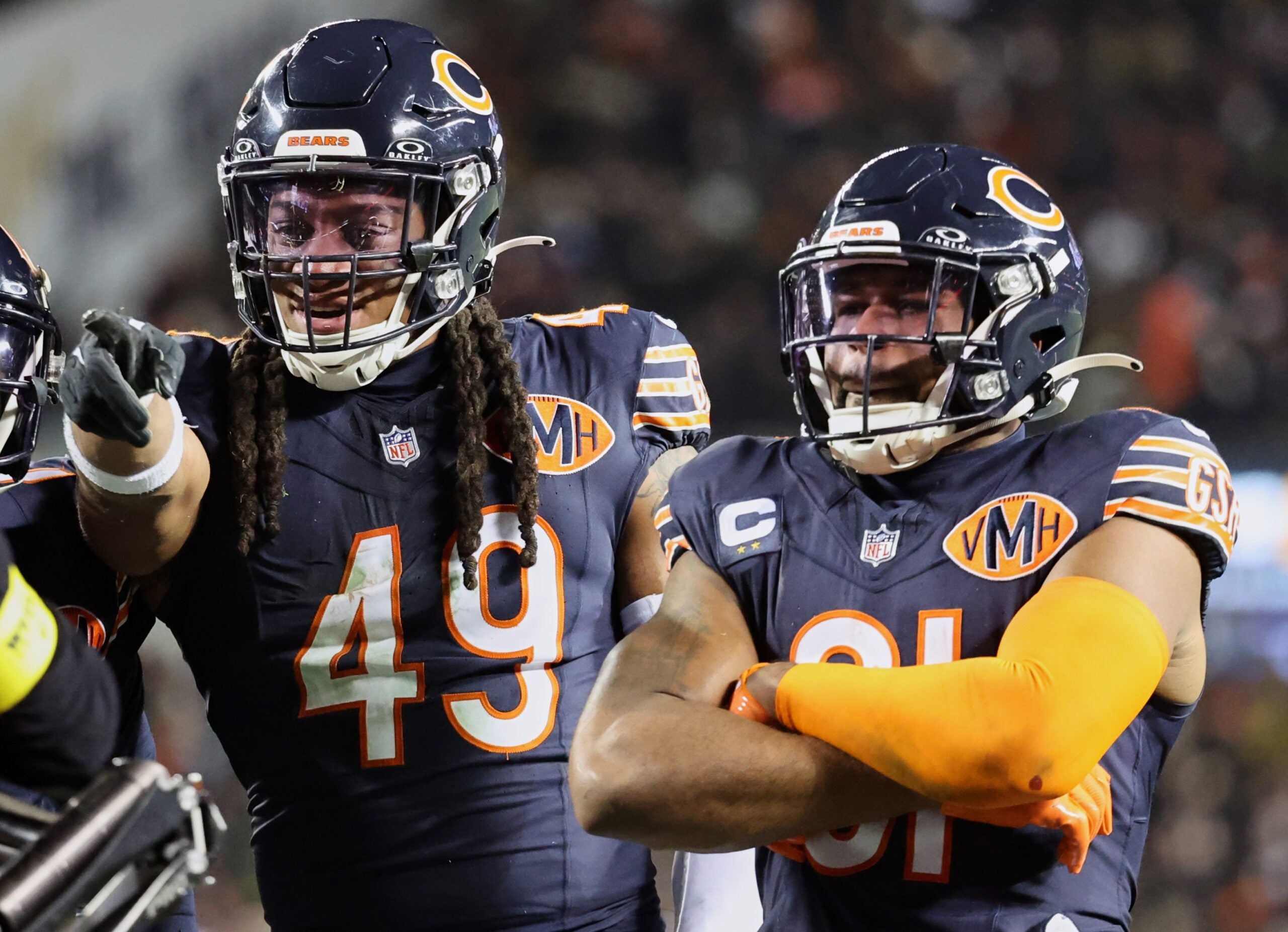 Dec 20, 2025; Chicago, Illinois, USA; Chicago Bears linebacker Tremaine Edmunds (49) poses for a television camera with safety Kevin Byard III (31) after recovering a fumble against the Green Bay Packers during the third quarter at Soldier Field.
