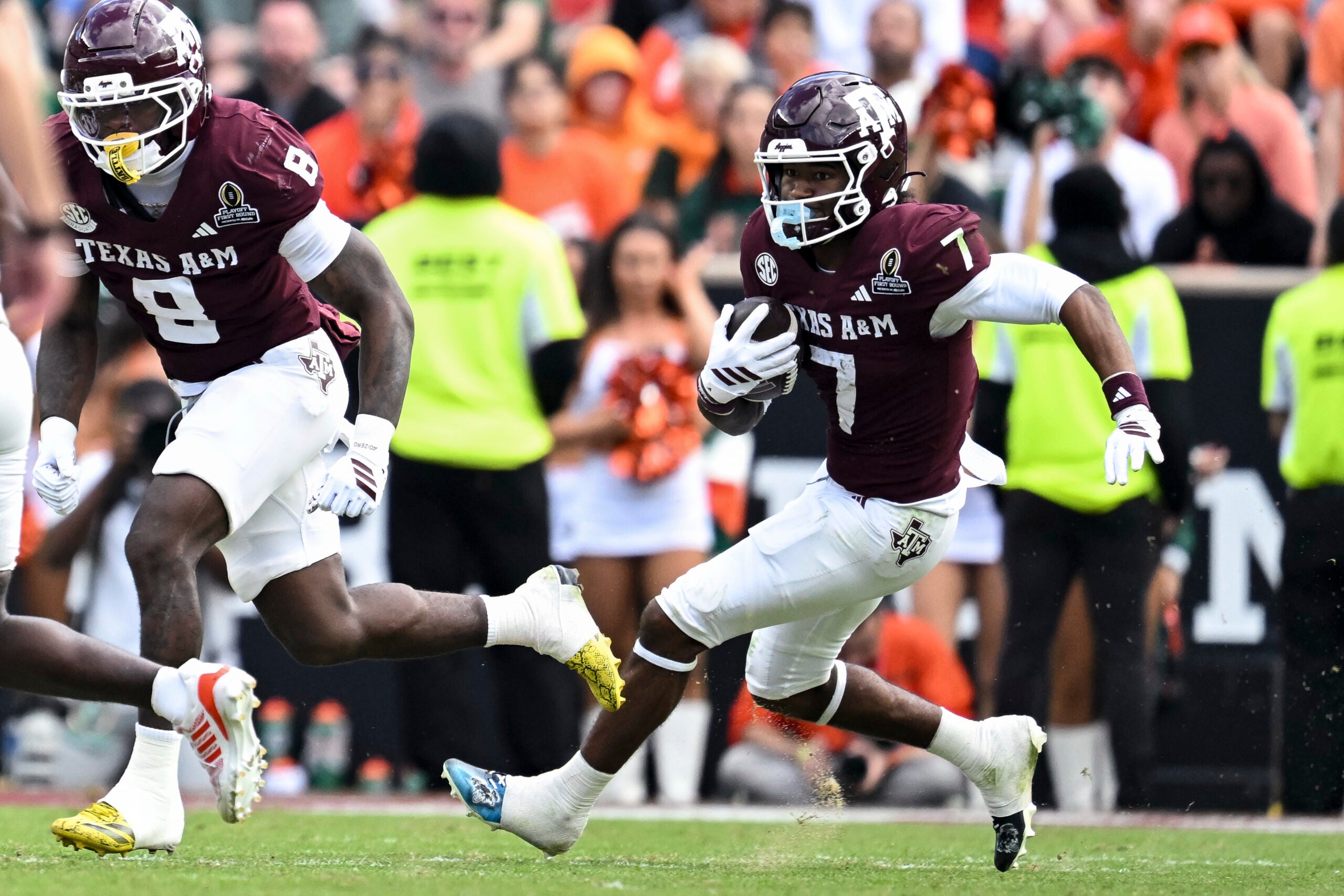 Dec 20, 2025; College Station, TX, USA; Texas A&M Aggies wide receiver KC Concepcion (7) runs the ball against the Miami Hurricanes during the second half at Kyle Field.