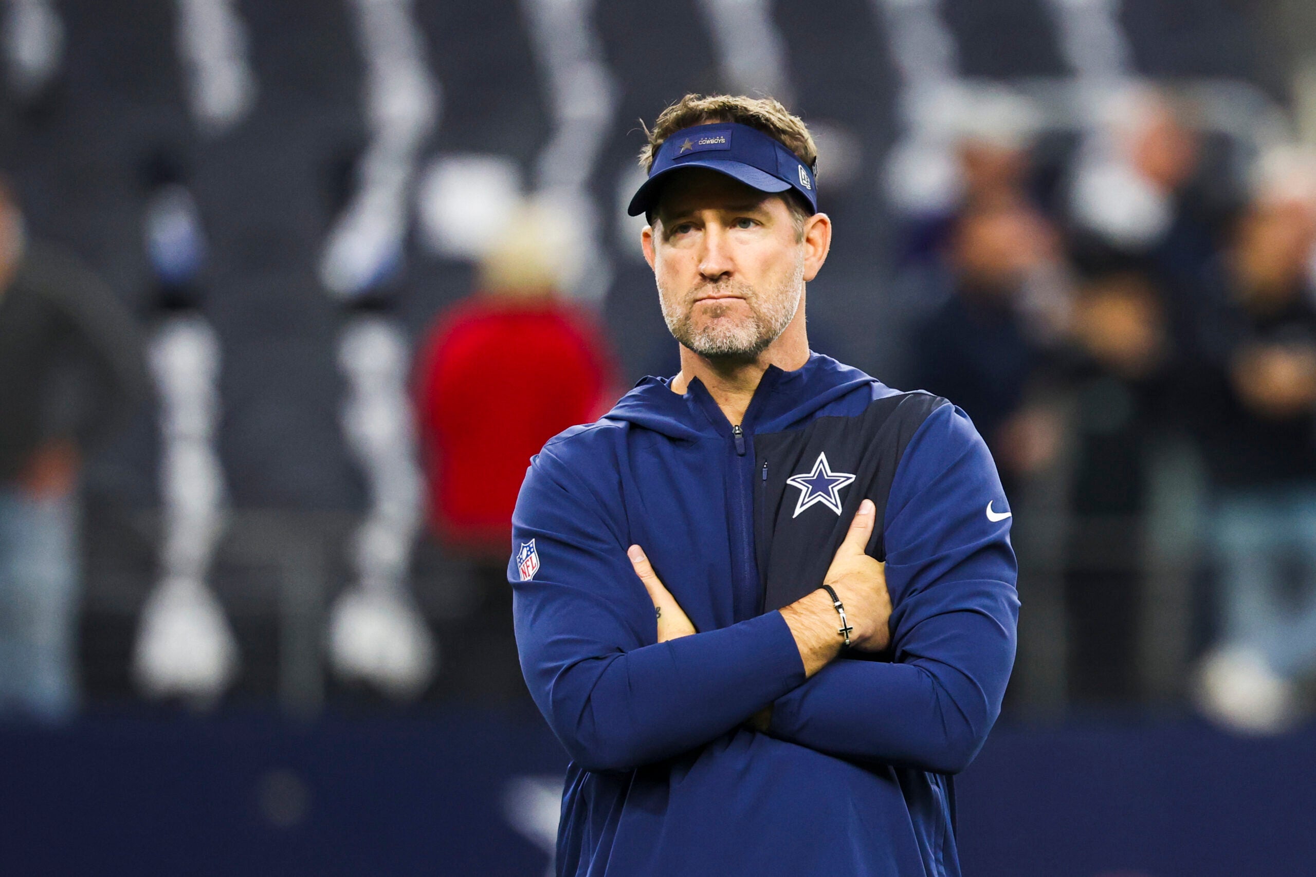Dec 21, 2025; Arlington, Texas, USA; Dallas Cowboys head coach Brian Schottenheimer watches pregame warmups against the Los Angeles Chargers at AT&T Stadium.