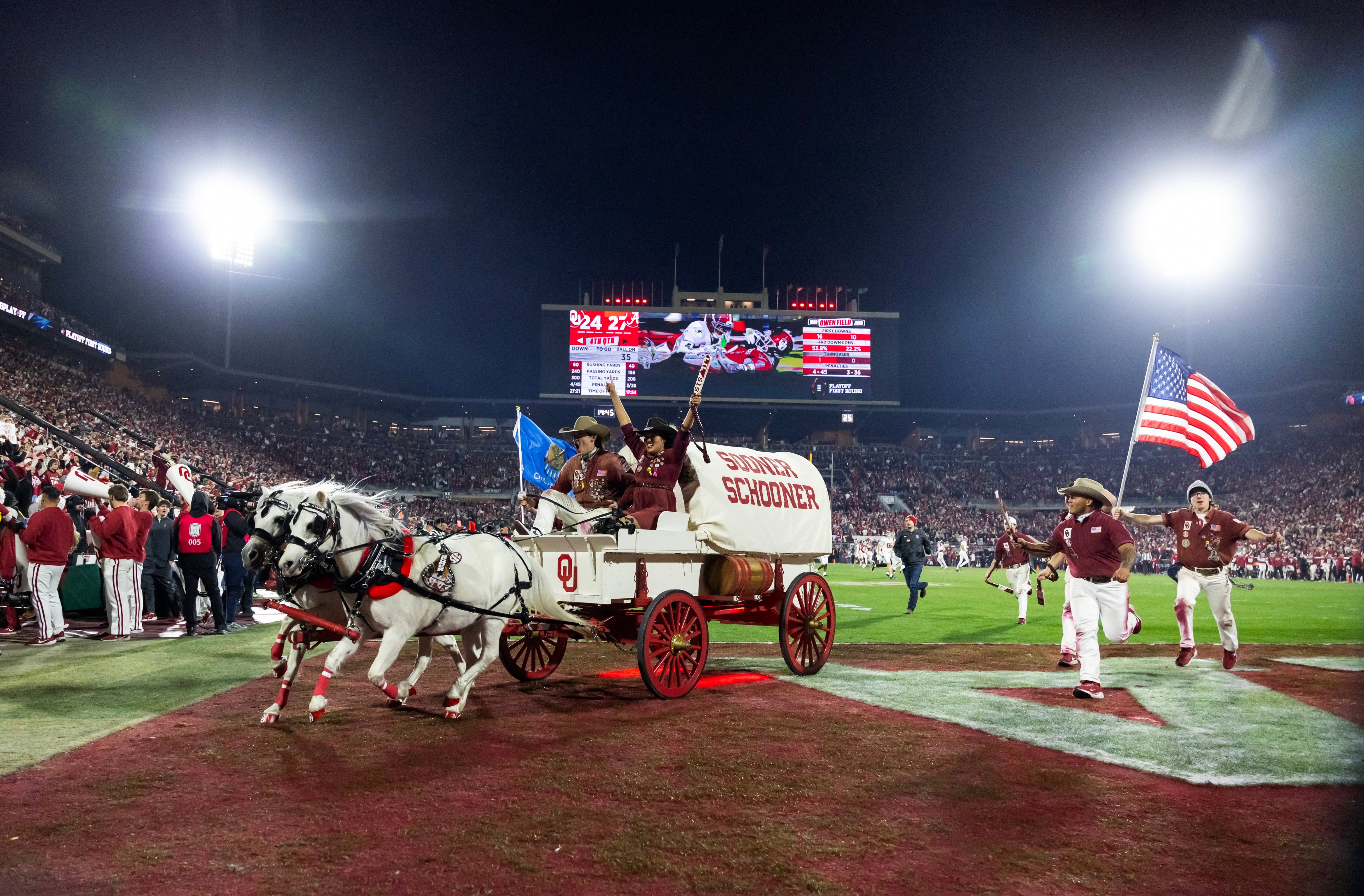 Dec 19, 2025; Norman, OK, USA; The Oklahoma Sooners Schooner horse drawn Conestoga wagon on the field during the game against the Alabama Crimson Tide at Gaylord Family OK Memorial Stadium.