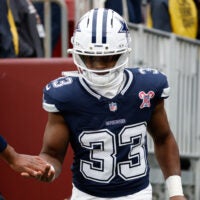 Dec 25, 2025; Landover, Maryland, USA; Dallas Cowboys running back Javonte Williams (33) runs onto the field for warmups before the game against the Washington Commanders at Northwest Stadium.